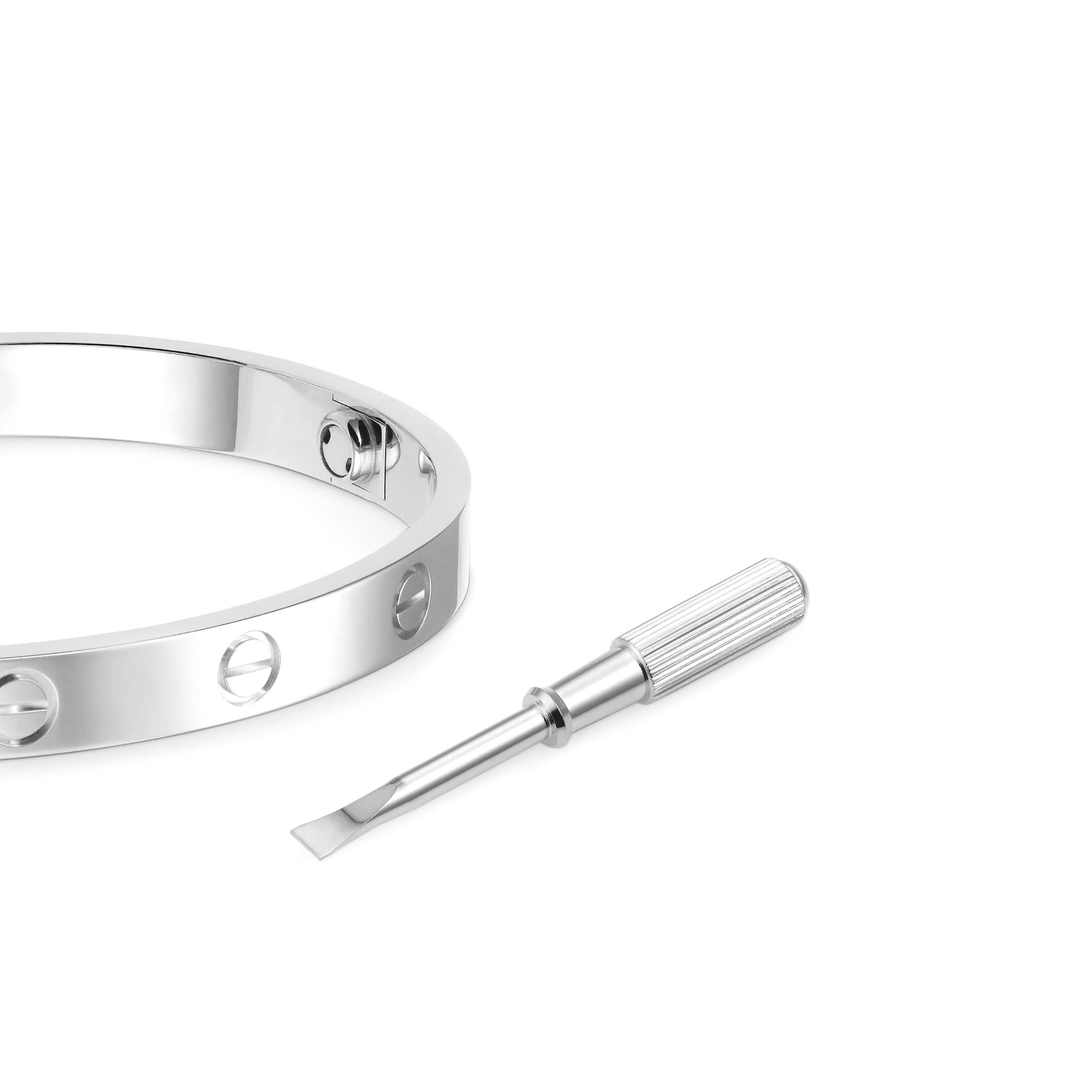 This iconic Cartier 'Love' bangle has been crafted in 18 carat white gold. The bangle is a Cartier size 17 and comes with the original Cartier screwdriver and box. Stamped Cartier 17 AOE390 Au 750.