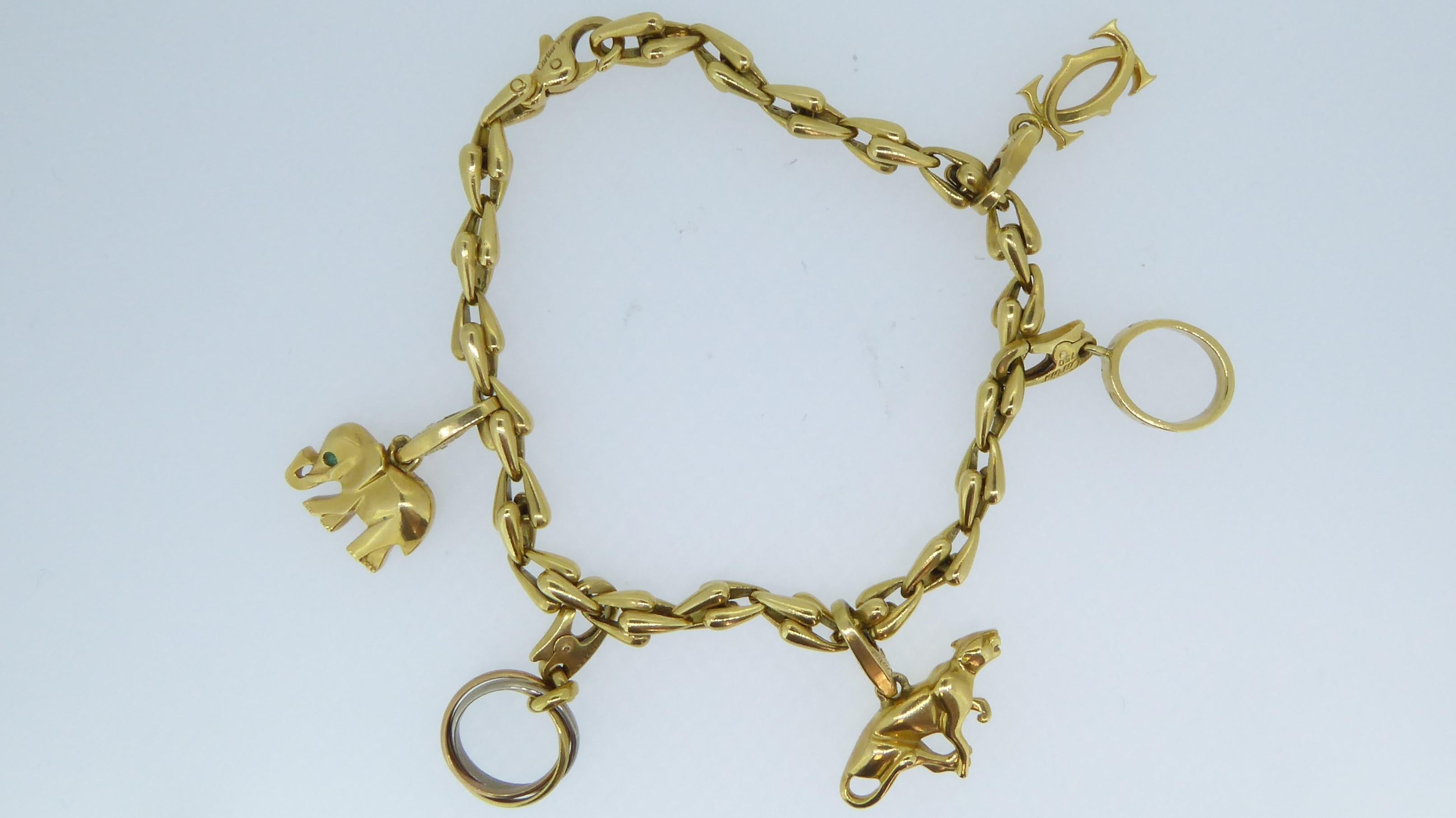 Cartier 18 Carat Yellow Gold 5 Charm Bracelet In Good Condition In London, GB