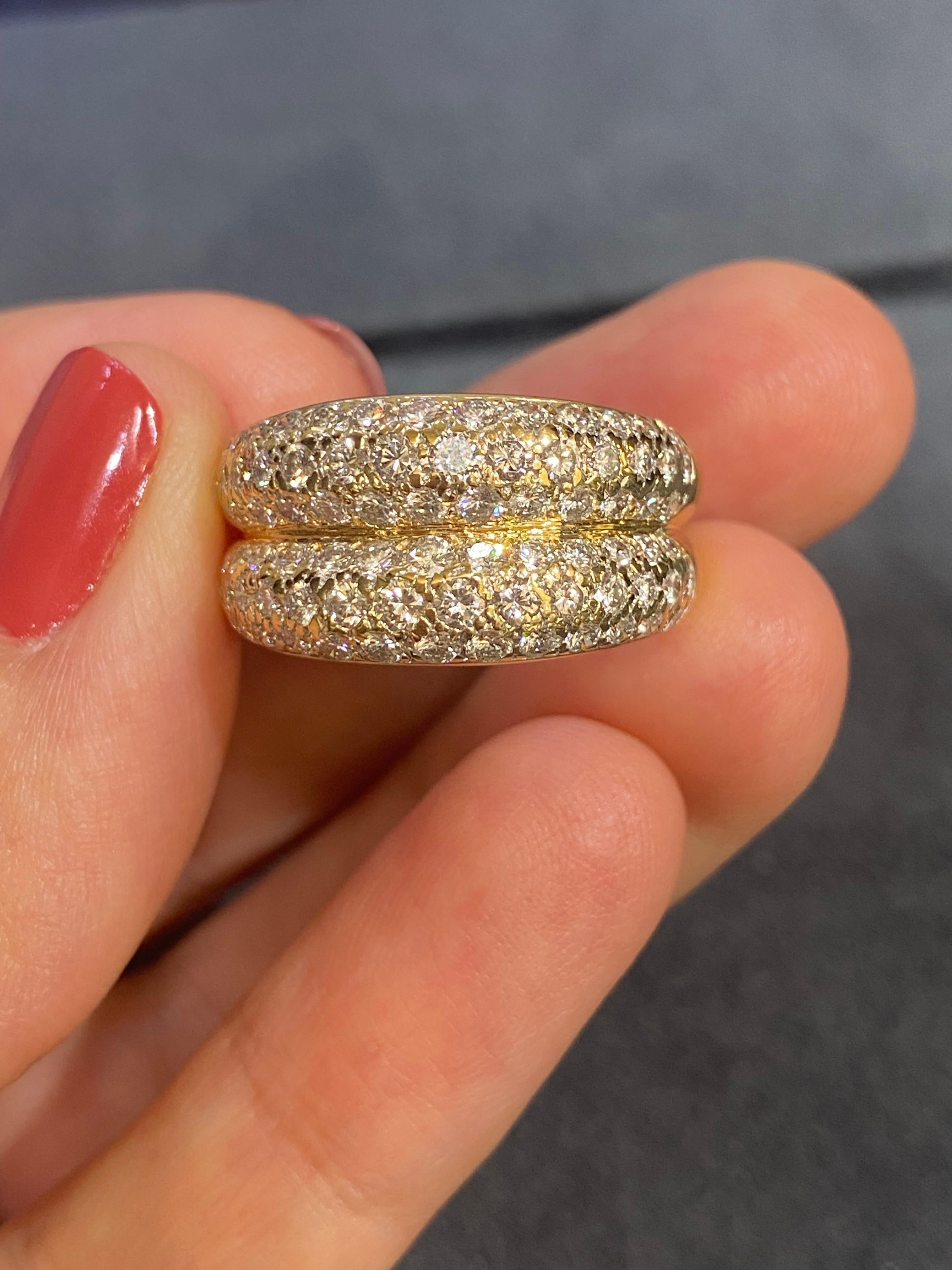This 18-carat gold Cartier double band ring with round diamonds, crafted in 1993, exudes timeless elegance and exceptional craftsmanship. Its exquisite design showcases a dual-band feature, symbolizing unity and harmony. The radiant 18-carat gold
