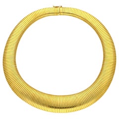Cartier 18 Carat Yellow Gold Wide Flattened Gas-Pipe Style Necklace, circa 1950s