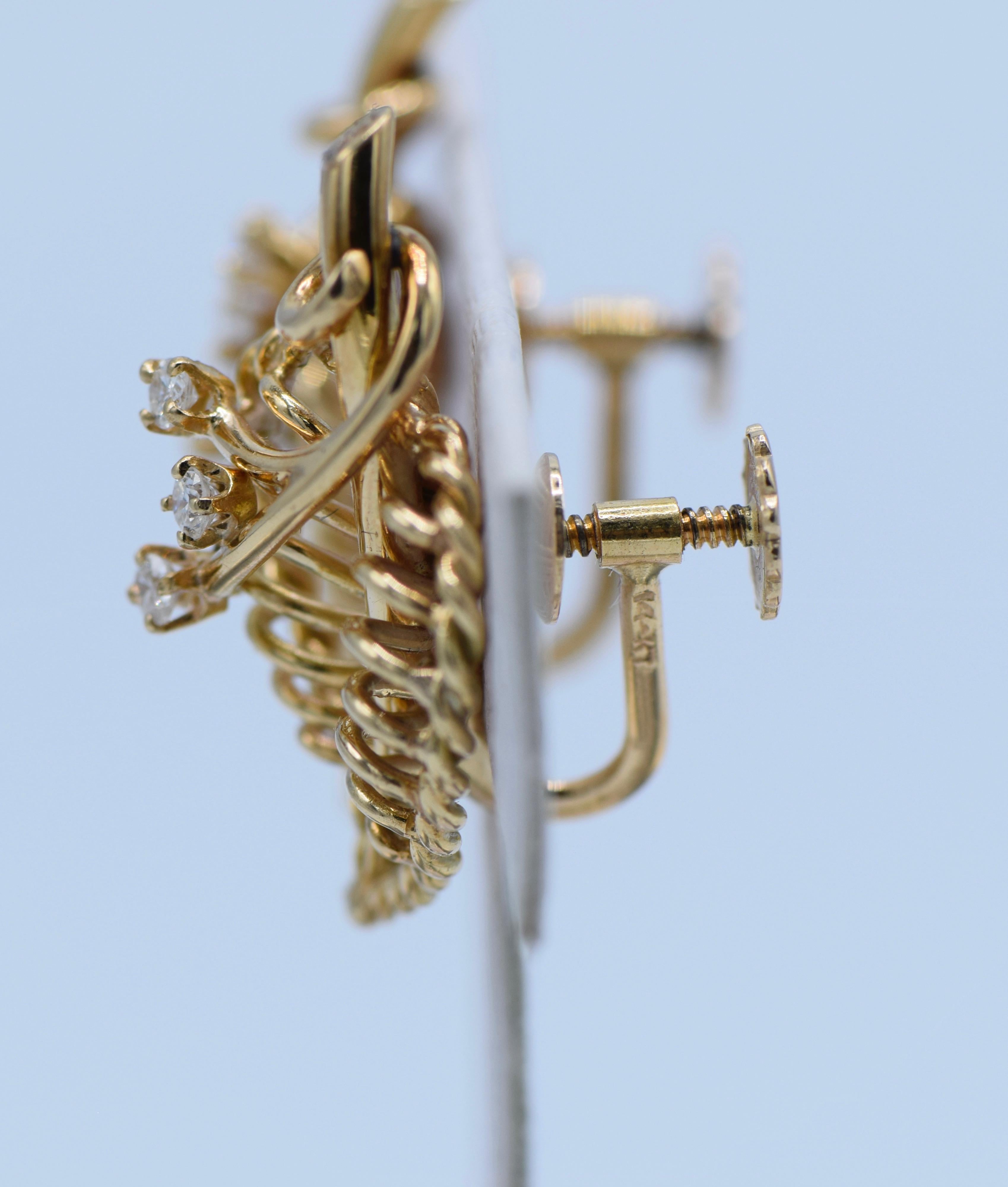 Stylish 18K Gold and Diamond intricately shaped leaf earrings by Cartier, circa 1940. The earrings each feature 3 Diamonds for a total of 6 Diamonds upon each leaf. These earrings are beautifully made and can be adorned for an evening or daytime