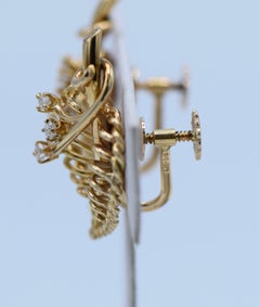 Cartier, 18 Karat Gold and Diamond Leaf Twist Back Earrings