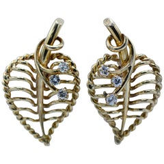Cartier, 18 Karat Gold and Diamond Leaf Twist Back Earrings