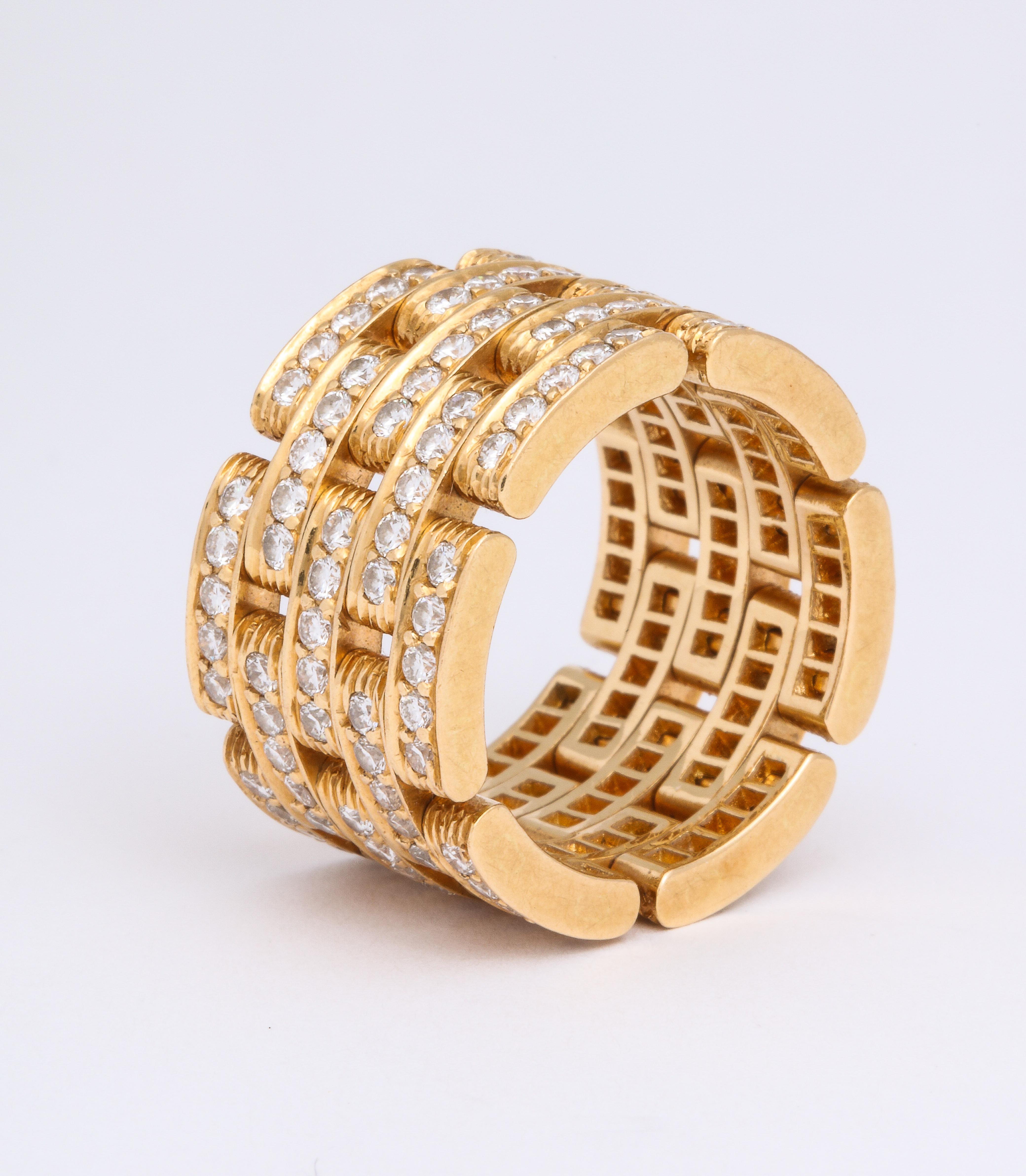 A must-have for the serious collector or the fashionista, this 18K yellow gold & diamond Cartier Pantherering is exquisitely set with approximately 4.50 carats total weight of round brilliant diamonds.  Letter of authenticity from Cartier.  US size