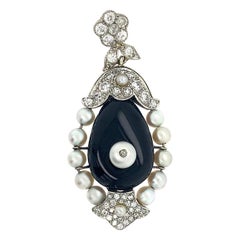 Cartier 18 Karat Gold Diamond Set with Onyx Pendant