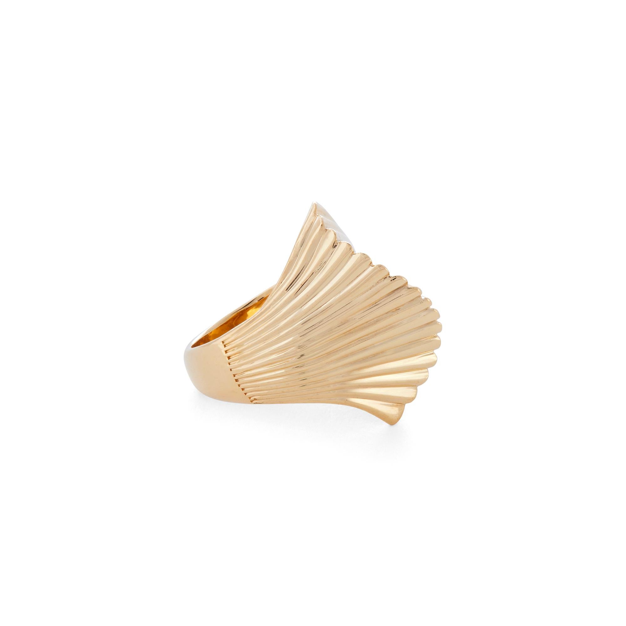 Authentic Cartier ring crafted in 18 karat yellow gold.  The fluted dome features a sensuous curve down the center resulting in a fan-like effect.  Size 6 1/4. Signed Cartier, 18k with serial number.  CIRCA 1980s

Brand: Cartier
Metal:  18k Yellow