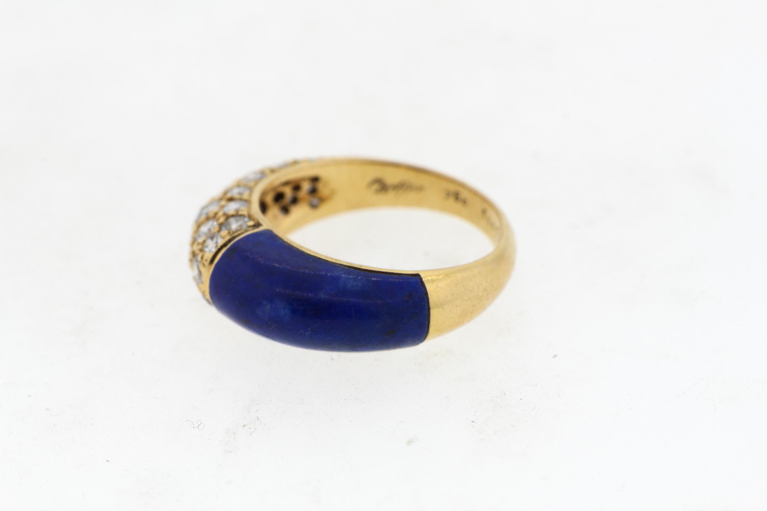 Vintage 18k gold lapis and diamond ring by Cartier circa 1970. The lapis and the diamonds oppose each other on the finger. One side is set with 30 modern round brilliant diamonds weighing about 1.10 cts total. The ring is slightly domed and would
