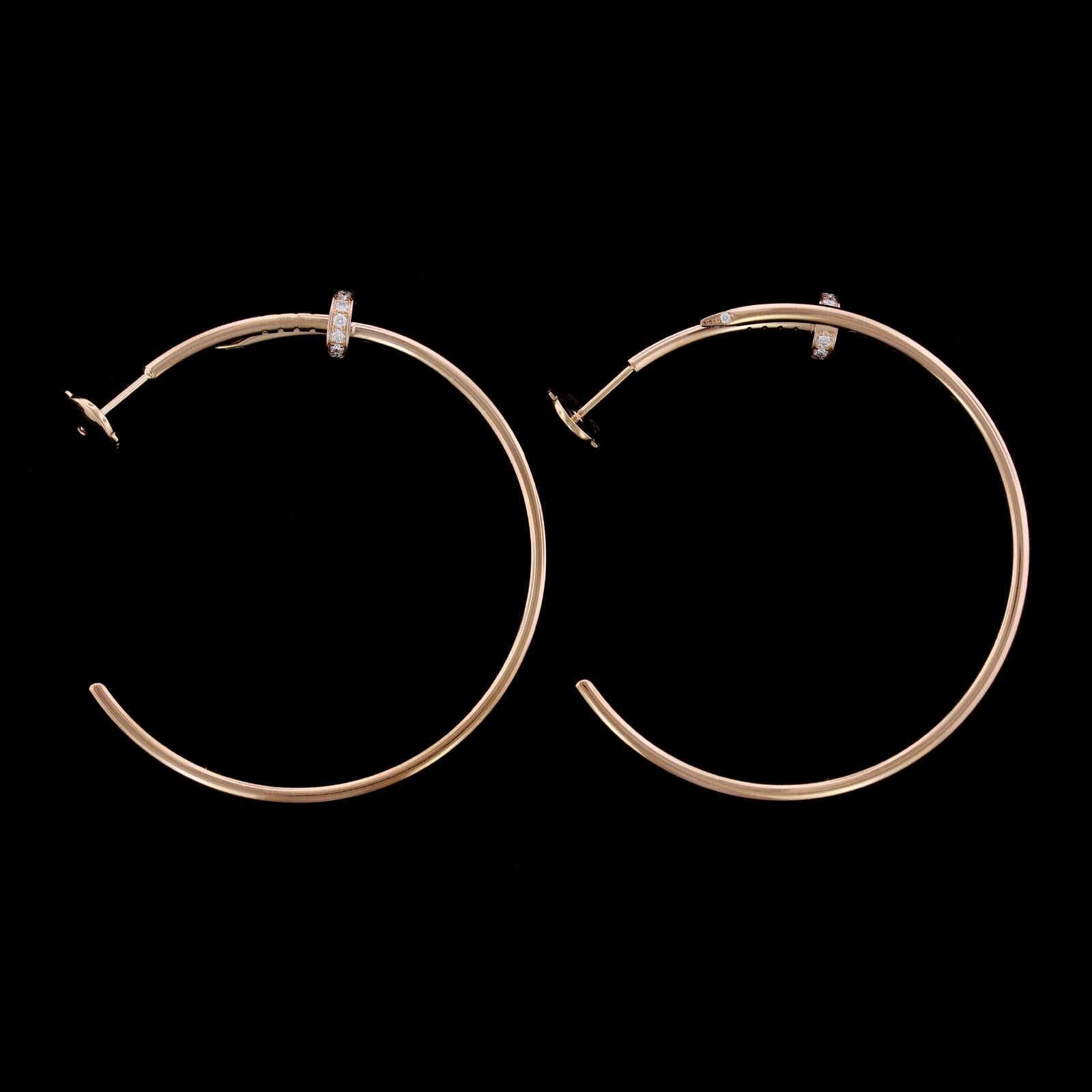 Cartier 18K Pink Gold Diamond Juste un Clou Earrings. The hoop earrings are
set with 28 round brilliant cut diamonds weighing .17cttw., CJZ104, length
1 5/8