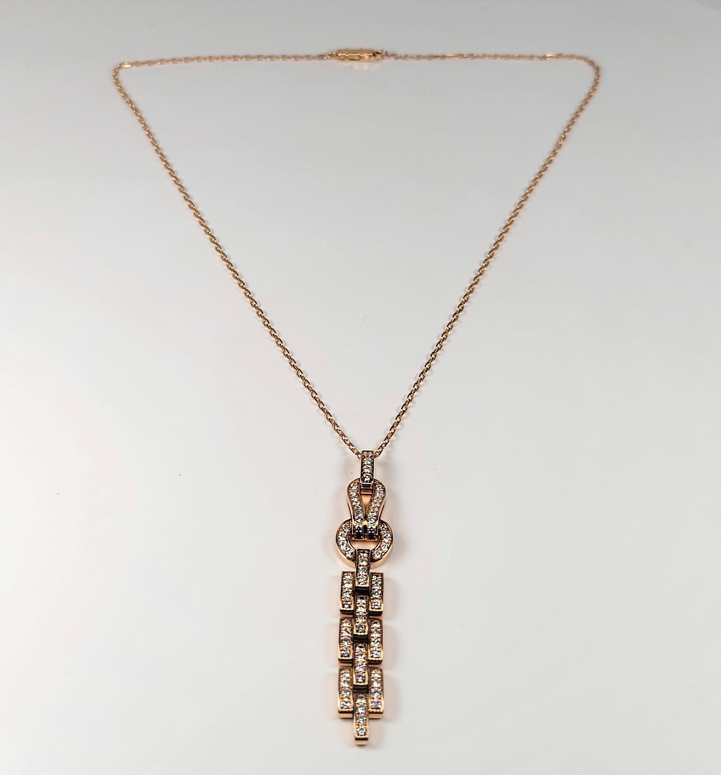From Iconic designer Cartier, this fabulous necklace is in 18 karat rose gold and is from the Agrafe Collection!  The pendant portion measures 2 3/4