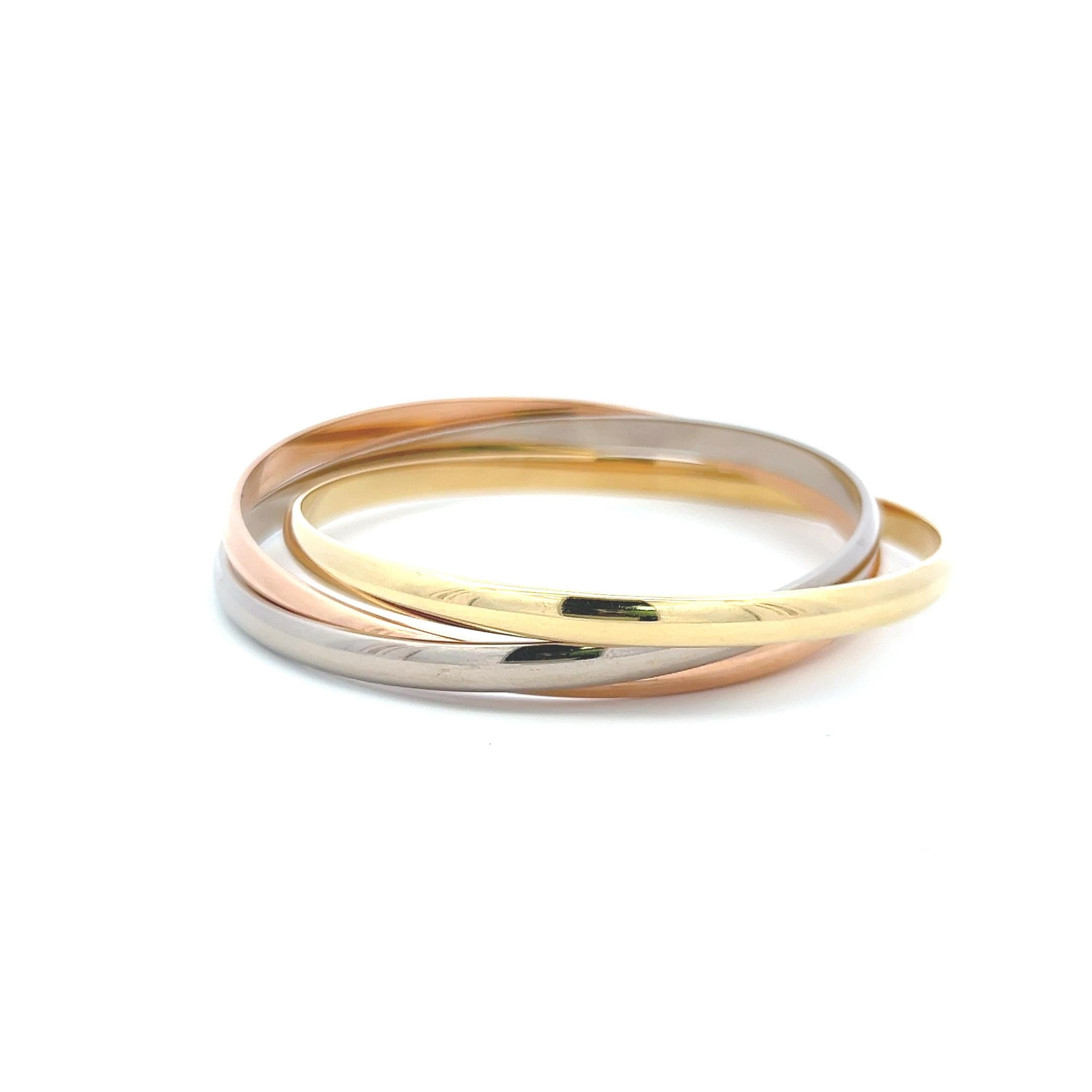 Cartier 18 Karat Tri Color Gold Bangle Trinity Bracelet with Paper Bon état - En vente à New York, NY