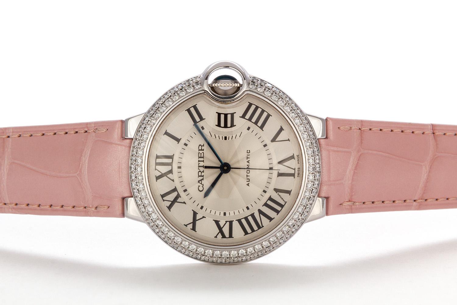We are pleased to offer this Authentic Cartier 18k White & Diamond Medium Size Ballon Bleu Automatic Watch. This Ballon Bleu de Cartier watch (ref. WE900651) features a BRAND NEW Cartier pink alligator strap with the original Cartier 18k white gold