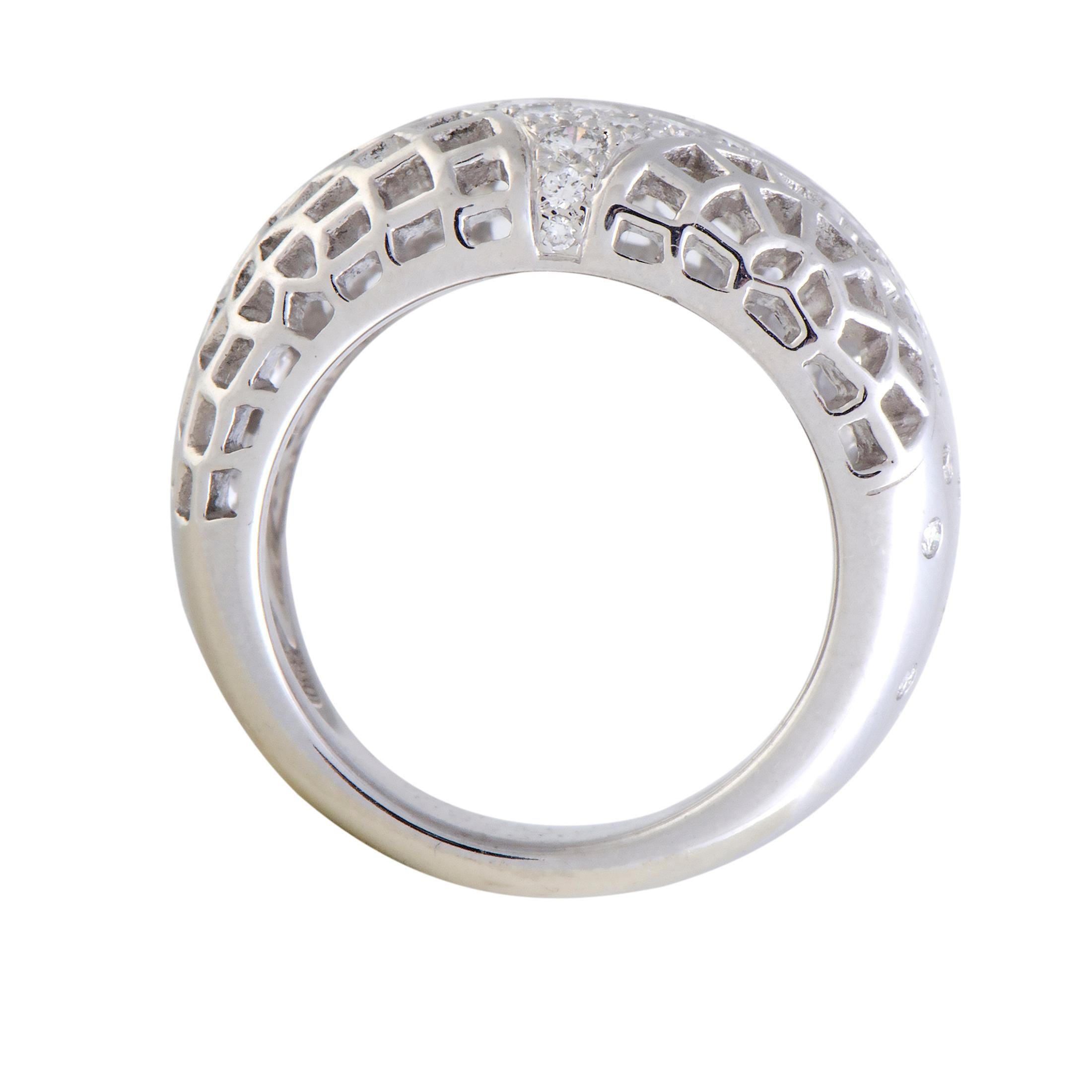 Dazzle your digits with this white gold ring characterized by its protruding design, half-moon mesh patterns and bedecked with a plethora of 0.47ct scintillating diamonds for everyday glamour. Crafted in 18K white gold by Cartier.

Ring Size: 6.75