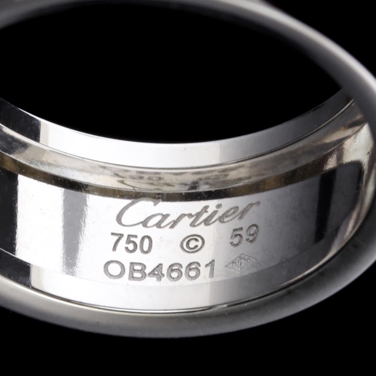 Cartier 18K White Gold Diamond Love Ring. The 10.00mm. wide ring is set with six full cut diamonds, #OB 4661, size 59, US 8 3/4, with original box.