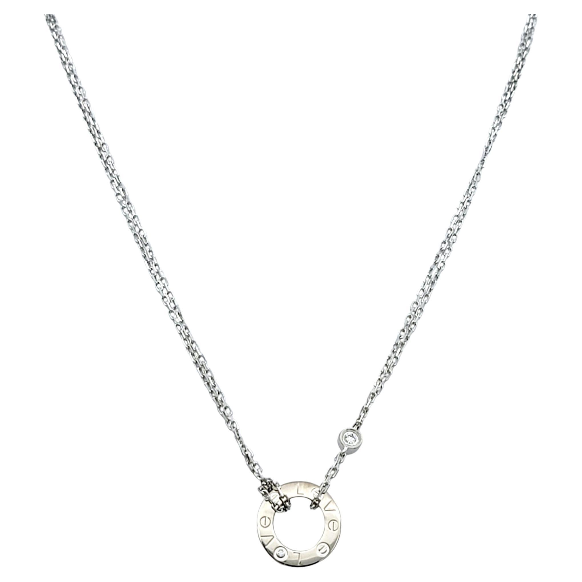 Embrace the essence of timeless romance with the Cartier Love Necklace, a masterpiece of exquisite design and refined elegance. This stunning piece features delicate double strands of lustrous 18 karat white gold, gracefully framing the iconic Love