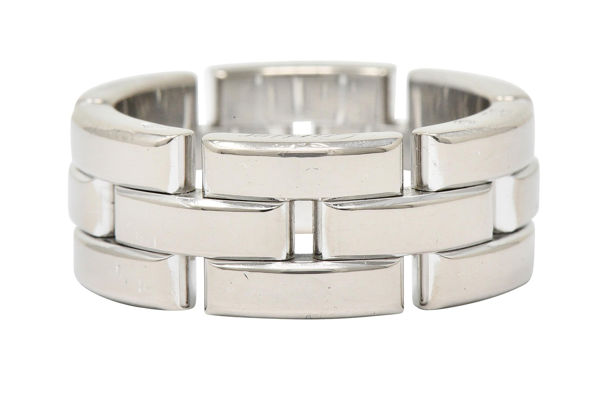 Wide band ring is designed as interlocking rectangular forms

With a brightly polished finish

Numbered, fully signed Cartier, and with French maker's mark

Stamped 750 and with French assay marks for 18 karat gold

From the contemporary Maillon