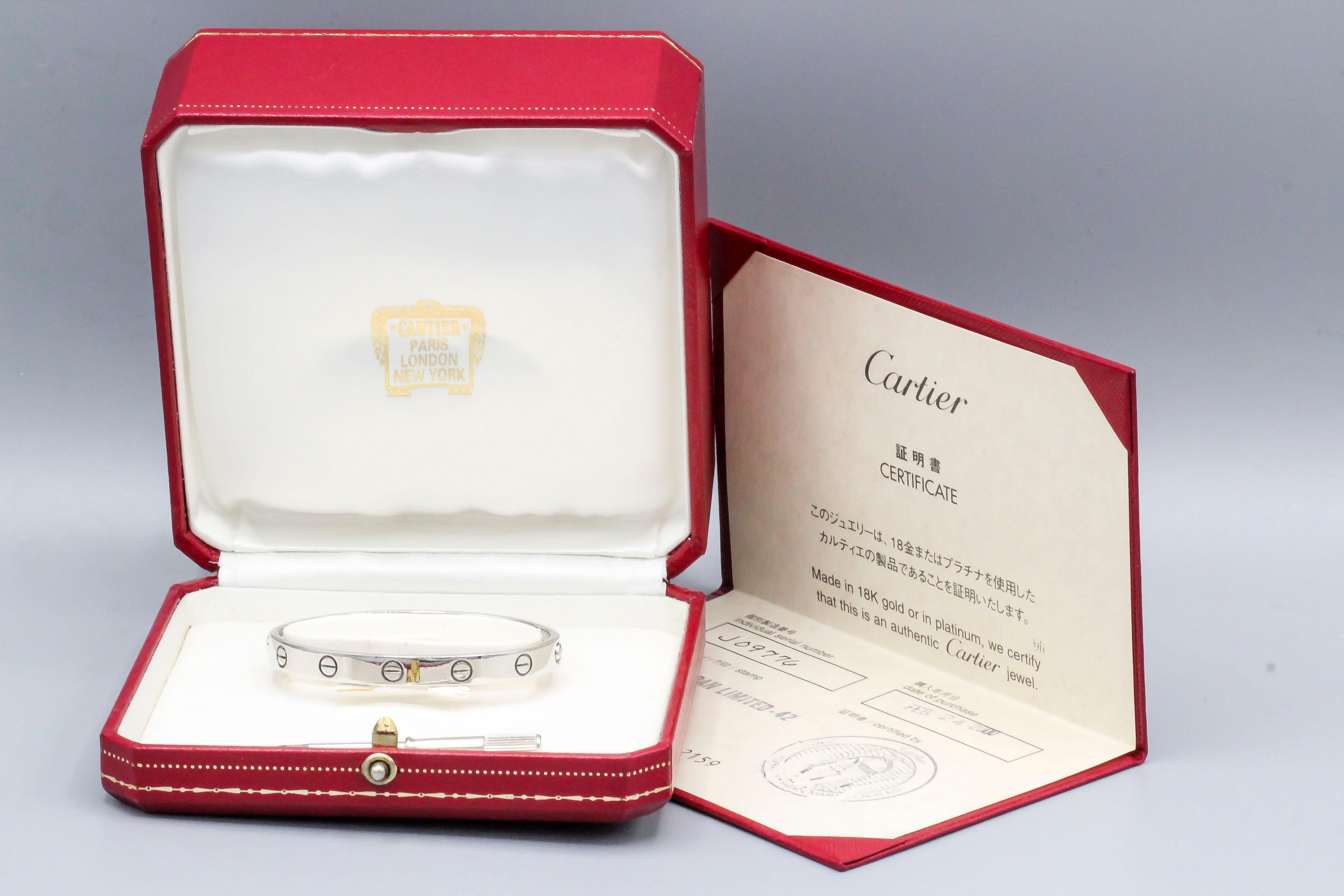 Classic 18k white gold Cartier Love bracelet.  It is a size 16, comes with the screwdriver and box, as well as Cartier certificate.  Current retail $6750

Hallmarks: Cartier 1993, 750, reference numbers, 16