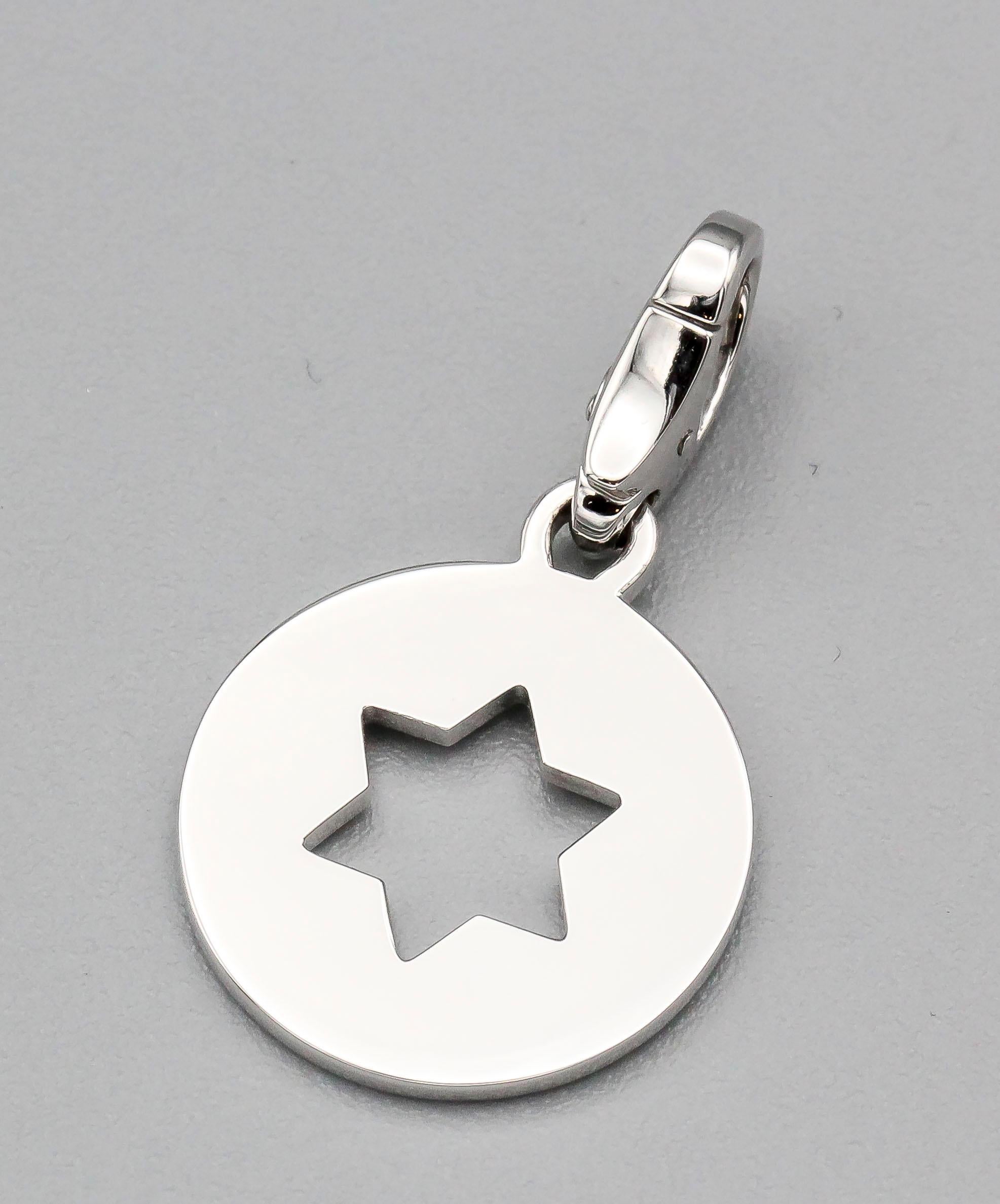 Fine 18k white gold Star of David charm by Cartier.

Hallmarks: Cartier, 750, reference numbers.