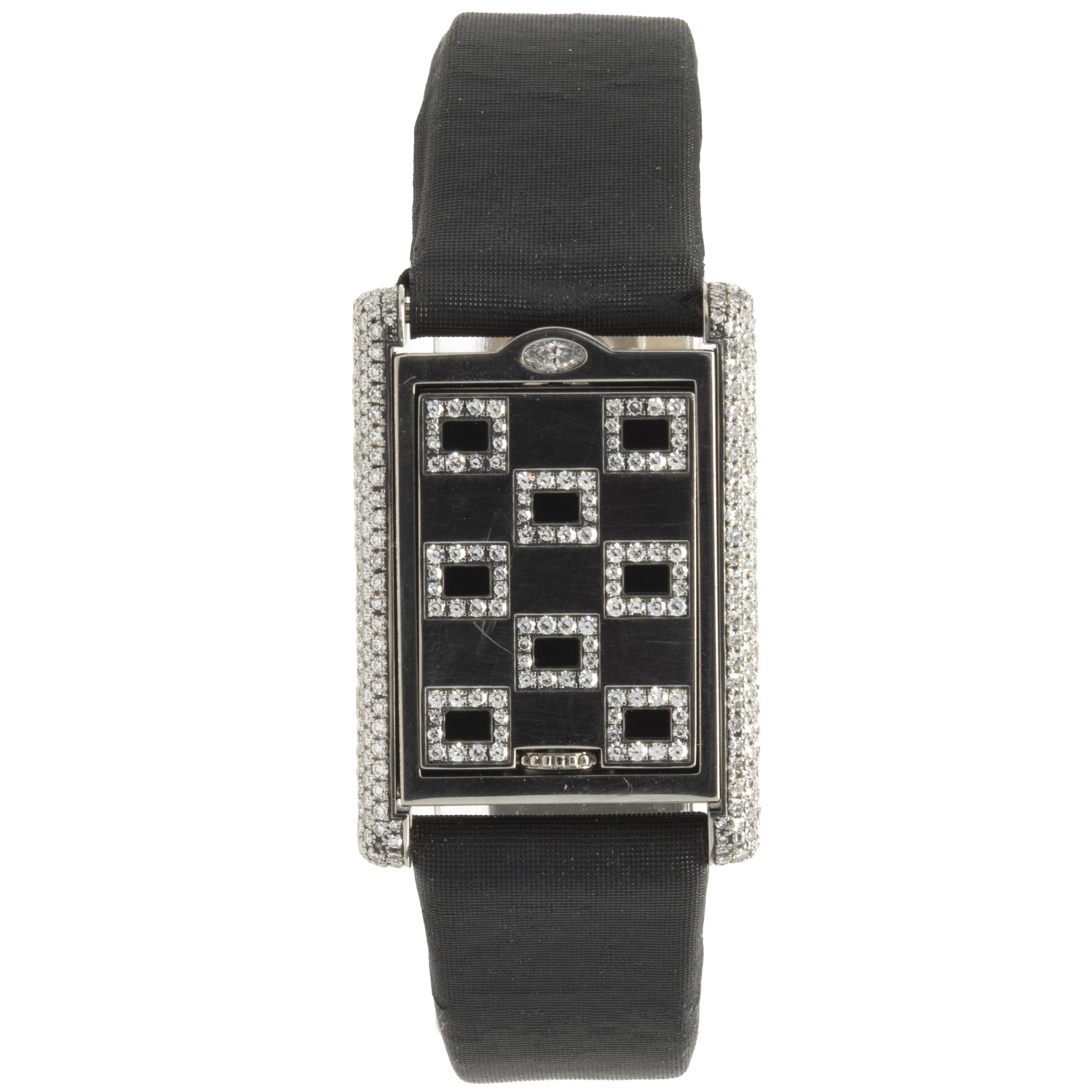 Movement: quartz
Function: hours, minutes, seconds, date
Case: 32.5 x 22.5mm 18K white gold rectangular case, factory diamond bezel, push pull crown, sapphire crystal
Dial: white roman dial, steel sword sweeping hands
Band: Cartier black leather