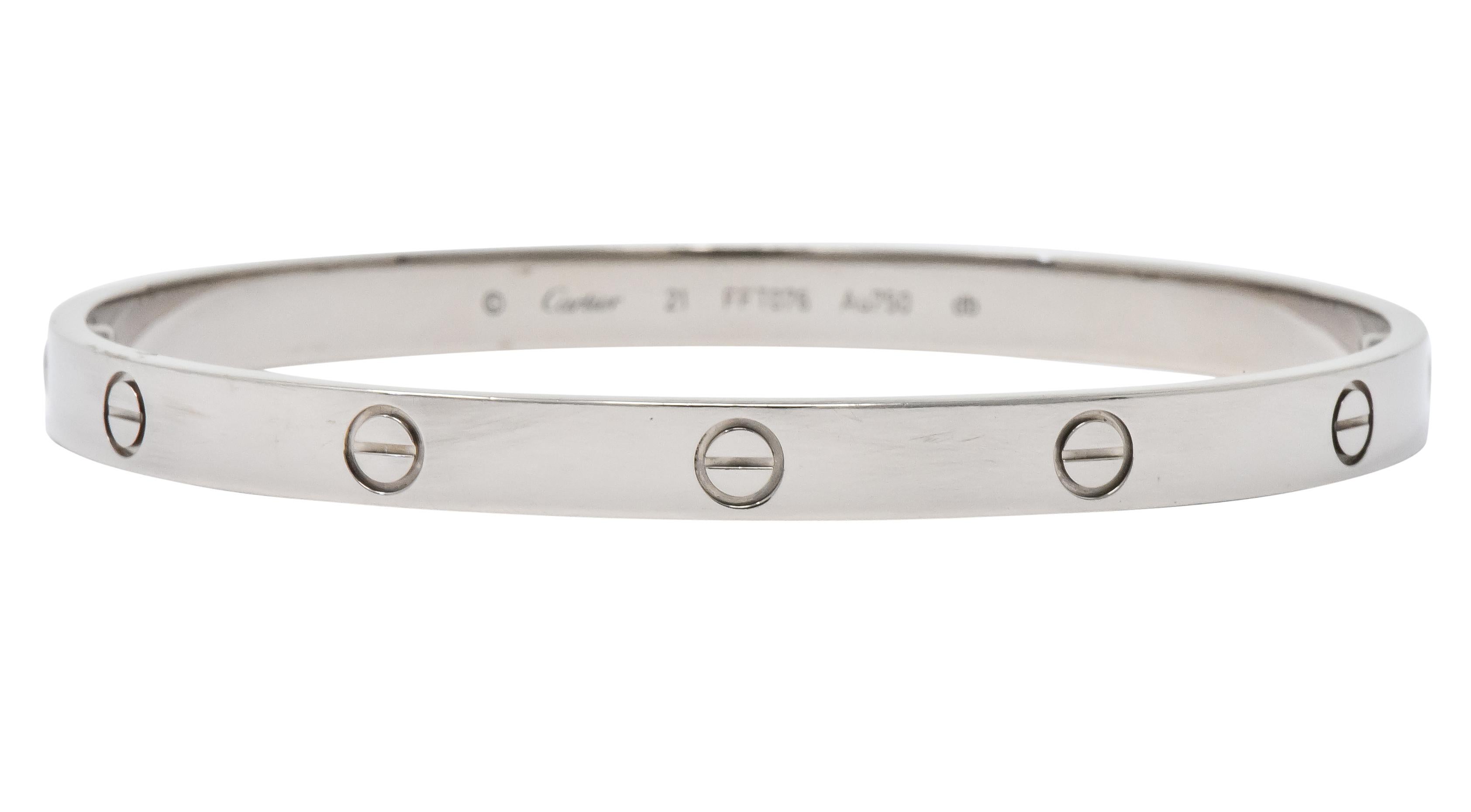 Bangle style bracelet deeply engraved with iconic screw head motif

With a high polished finish

Opens via two removable screws

From the coveted Love collection

Numbered and fully signed Cartier

Stamped Au 750 for 18 karat gold

Inner