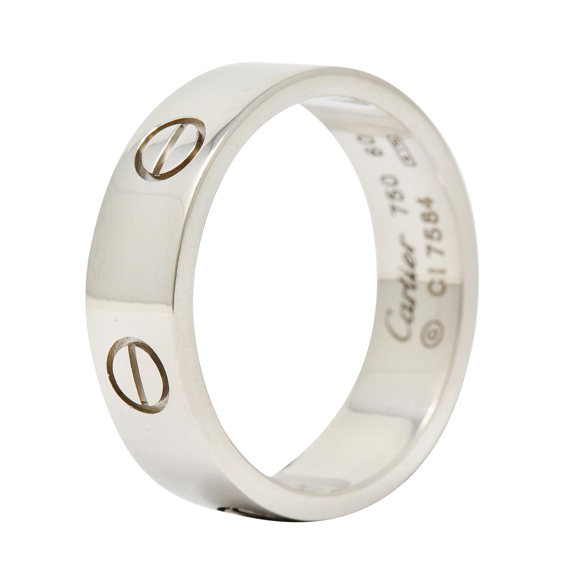 Wide band ring is deeply engraved with the iconic screwhead motif - fully around band

With a brightly polished finish

Stamped AU750 for 18 karat gold

Numbered and fully signed Cartier

From the coveted Love collection

Stamped 60 for Ring Size: 9