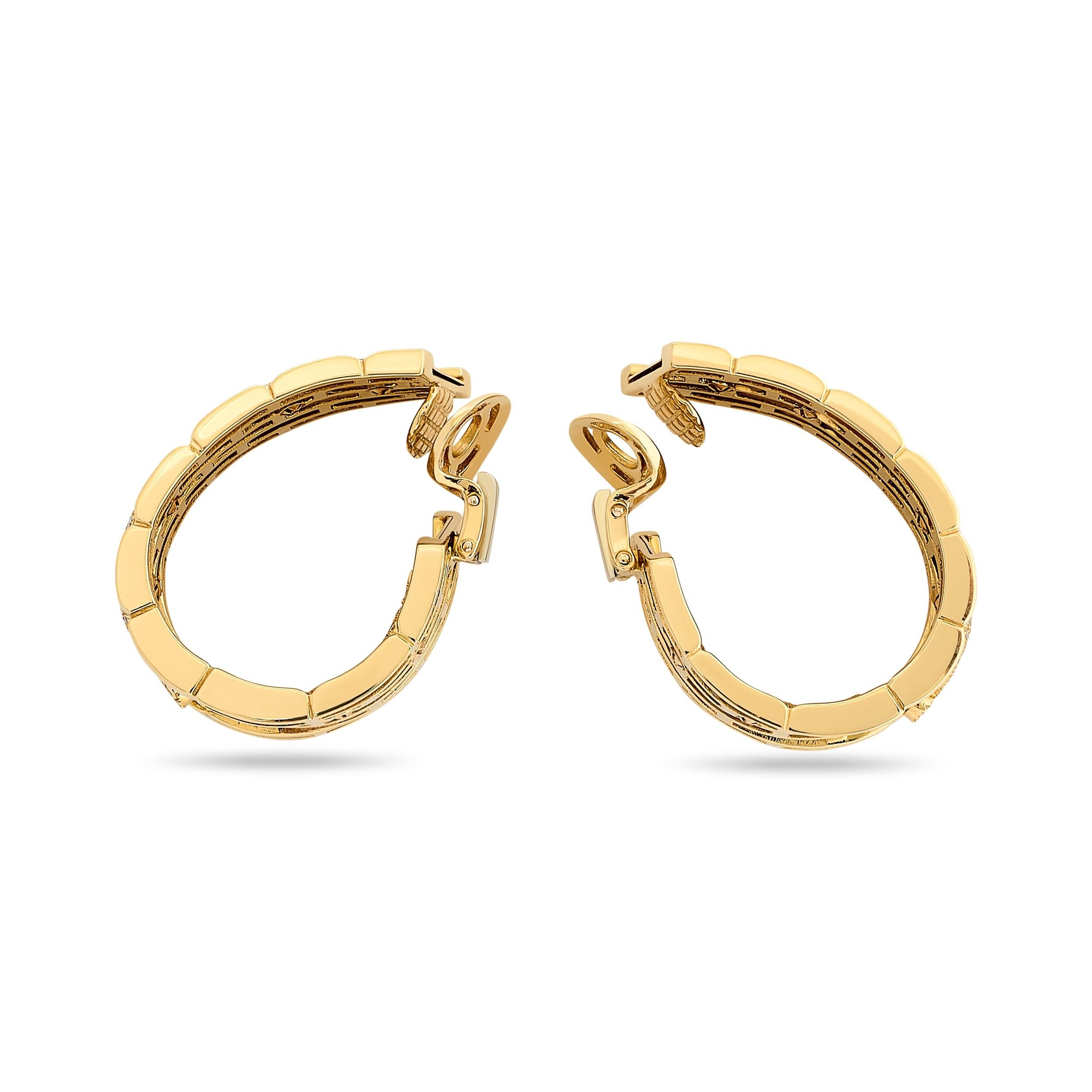 Untamed beauty and fierce elegance with these Cartier gold hoop earrings adorned with captivating diamond panthers.

This pair of Cartier earrings feature diamond panthers that have a total of 306 round brilliant cut diamonds that weigh