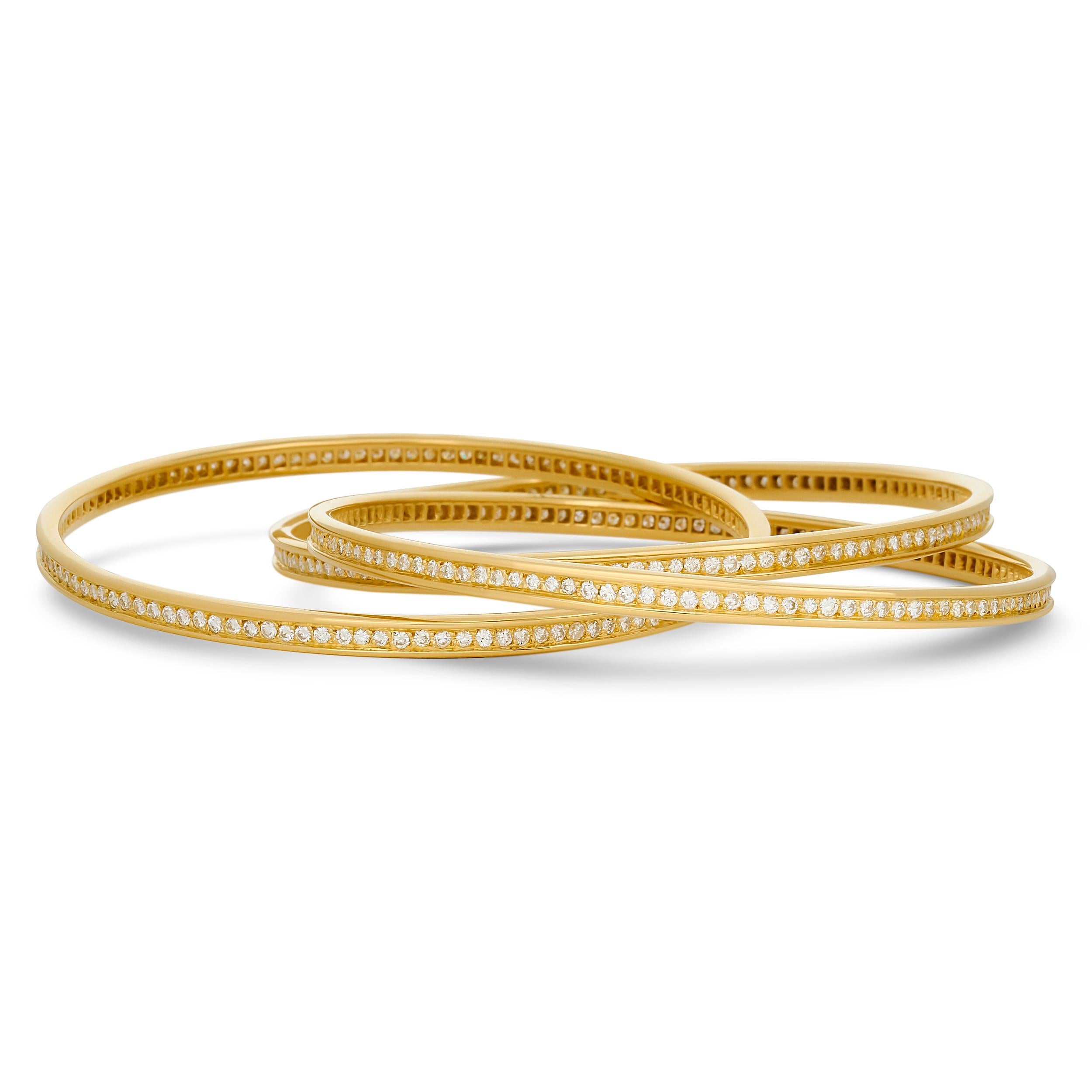 Round Cut Cartier 18 Karat Yellow Gold Diamond Trinity Rolling Bangle Bracelet For Sale