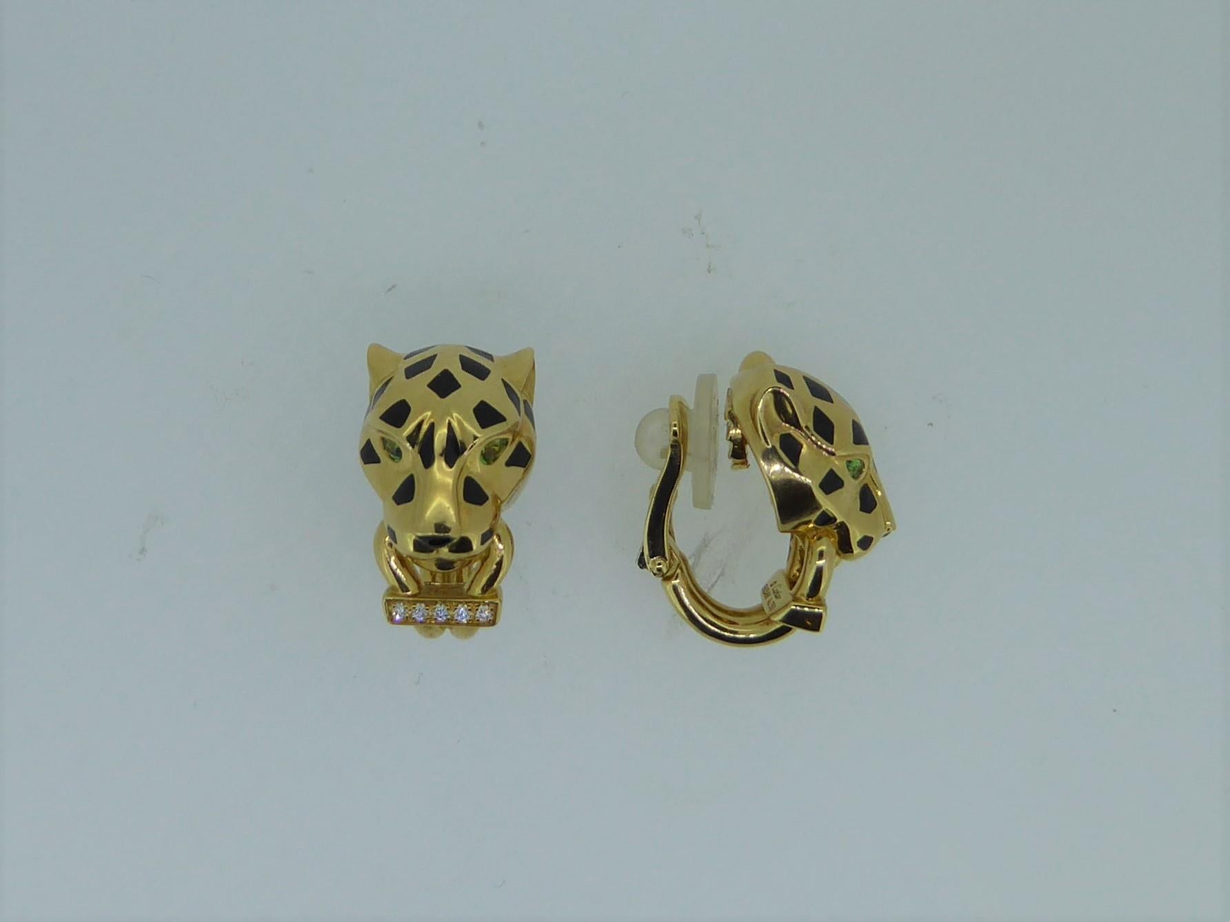 Pair of Cartier 18 Carat Yellow Gold, enamel, diamond and tsavorite garnet Panthere ear clips. Each earring signed 