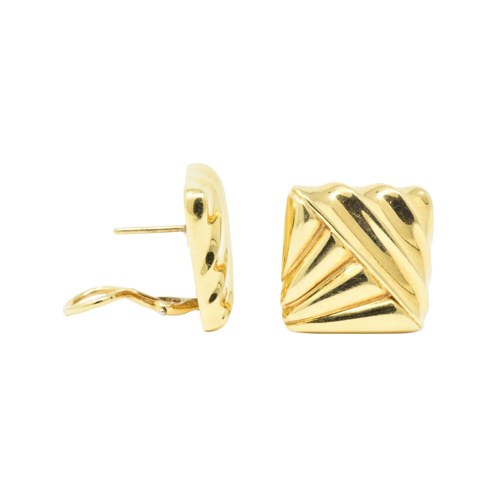 Cartier 18K Yellow Gold Earring Circa 1970
High polished fluted gold, with a geometric motif
Measuring: 19.75 mm x 19.77 mm
Post and omega backs
Fully Signed Cartier
Total Weight: 16.6 Grams
Clean. Classic. Cartier.
 

 

Stock Number: WE- 788