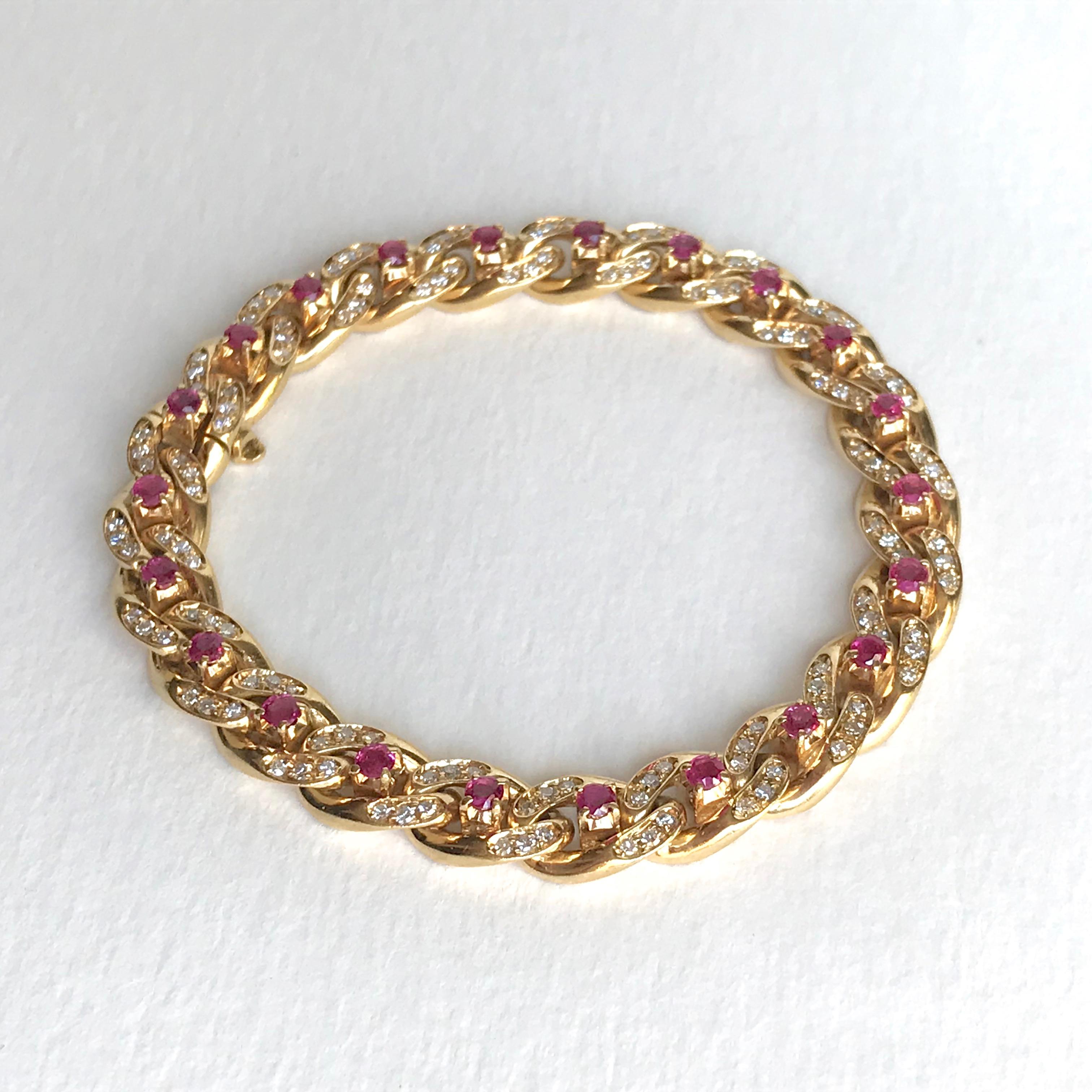 Cartier 18k yellow Gold Gourmet Link Bracelet with 22 Rubies and 132 Diamonds. 
Each link is set with 1 ruby and 6 Diamonds.
With Security. Signed Cartier and Numbered. Hallmark of Eagle. French work.
Gross Weight: 41.4g 
Length: 18cm Width: 0.8cm