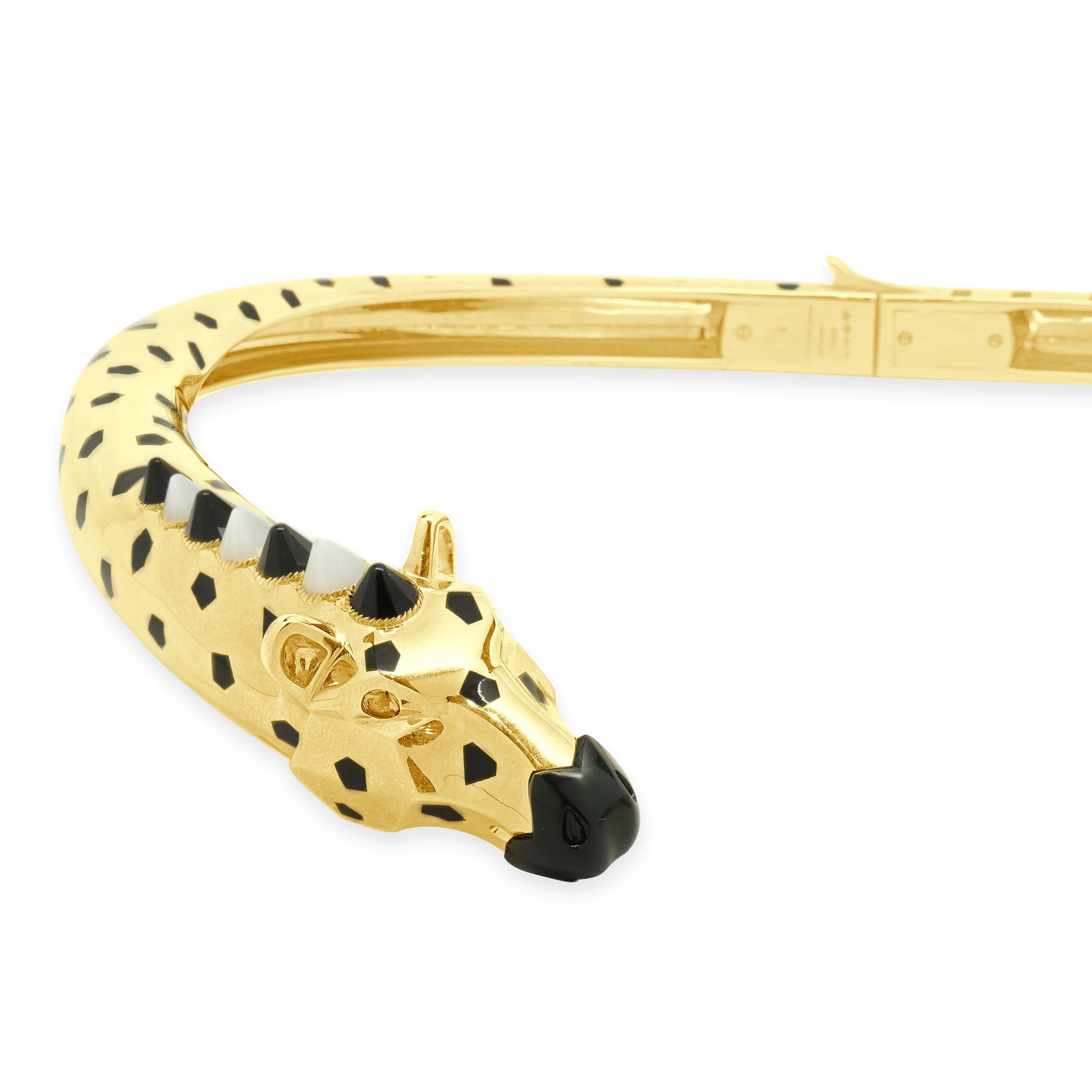 Designer: Cartier
Material: 18K yellow gold
Black Onyx, Tsavorite Garnet, Moonstone, and Black Lacquer
Serial # TTJXXX