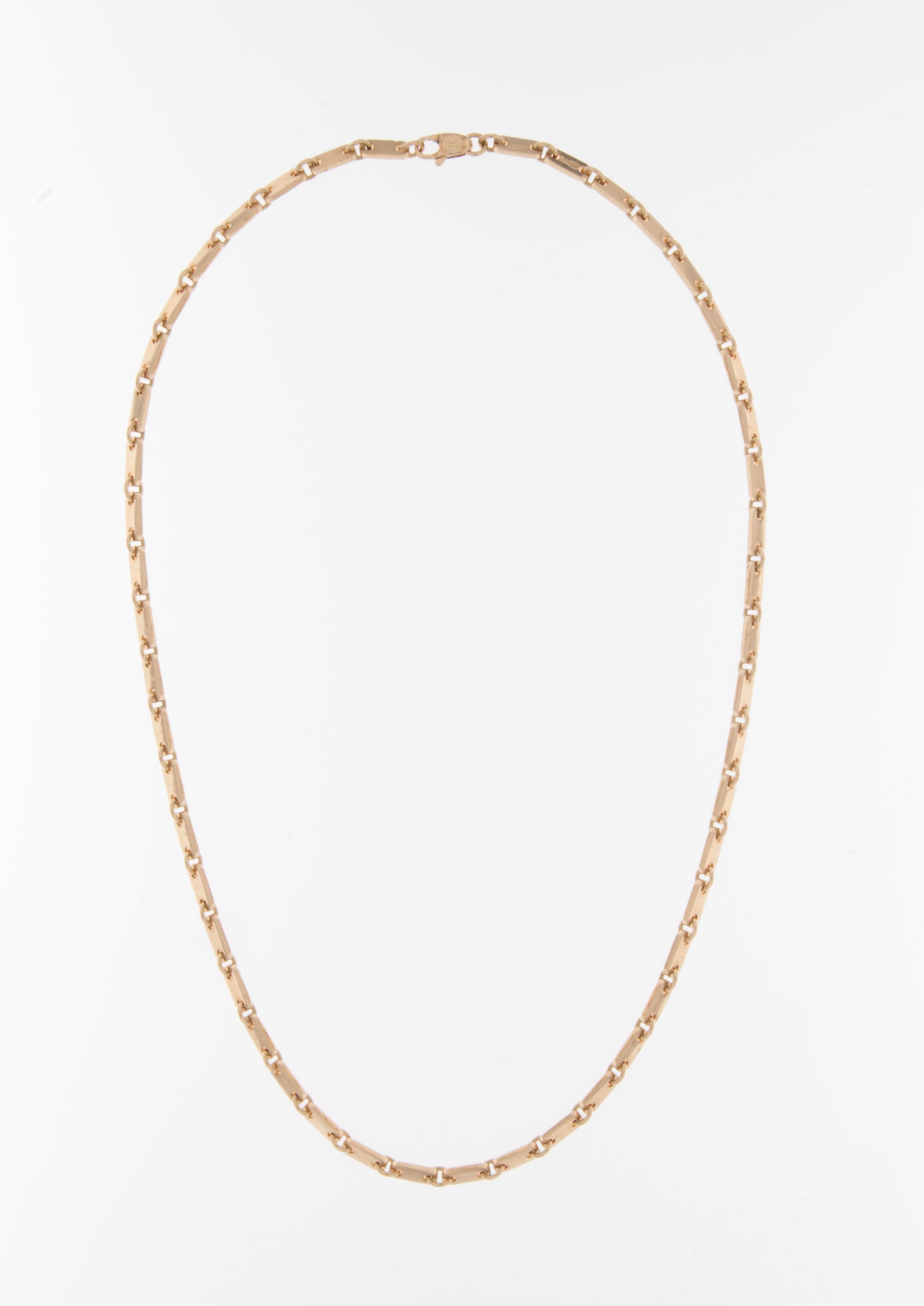 The Cartier 18-karat Yellow Gold Ingots Necklace is a stunning piece of jewelry created by the prestigious French luxury brand, Cartier. 

The necklace is crafted from 18-karat yellow gold, known for its lustrous and warm appearance. The use of