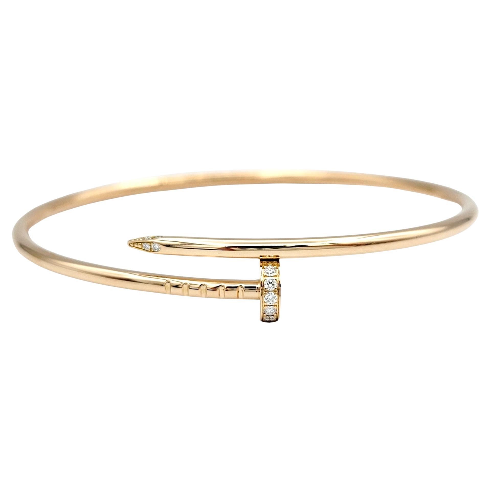The inner circumference of this bracelet measures 6.5 inches and will comfortably fit a 5.75 - 6.25 inch wrist. 

The Cartier Juste un Clou bracelet with diamonds in 18 karat yellow gold is a striking and contemporary piece of jewelry. The bypass