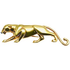 Retro Cartier 18 Karat Yellow Gold Panthere Brooch with Emerald Eyes and an Onyx Nose