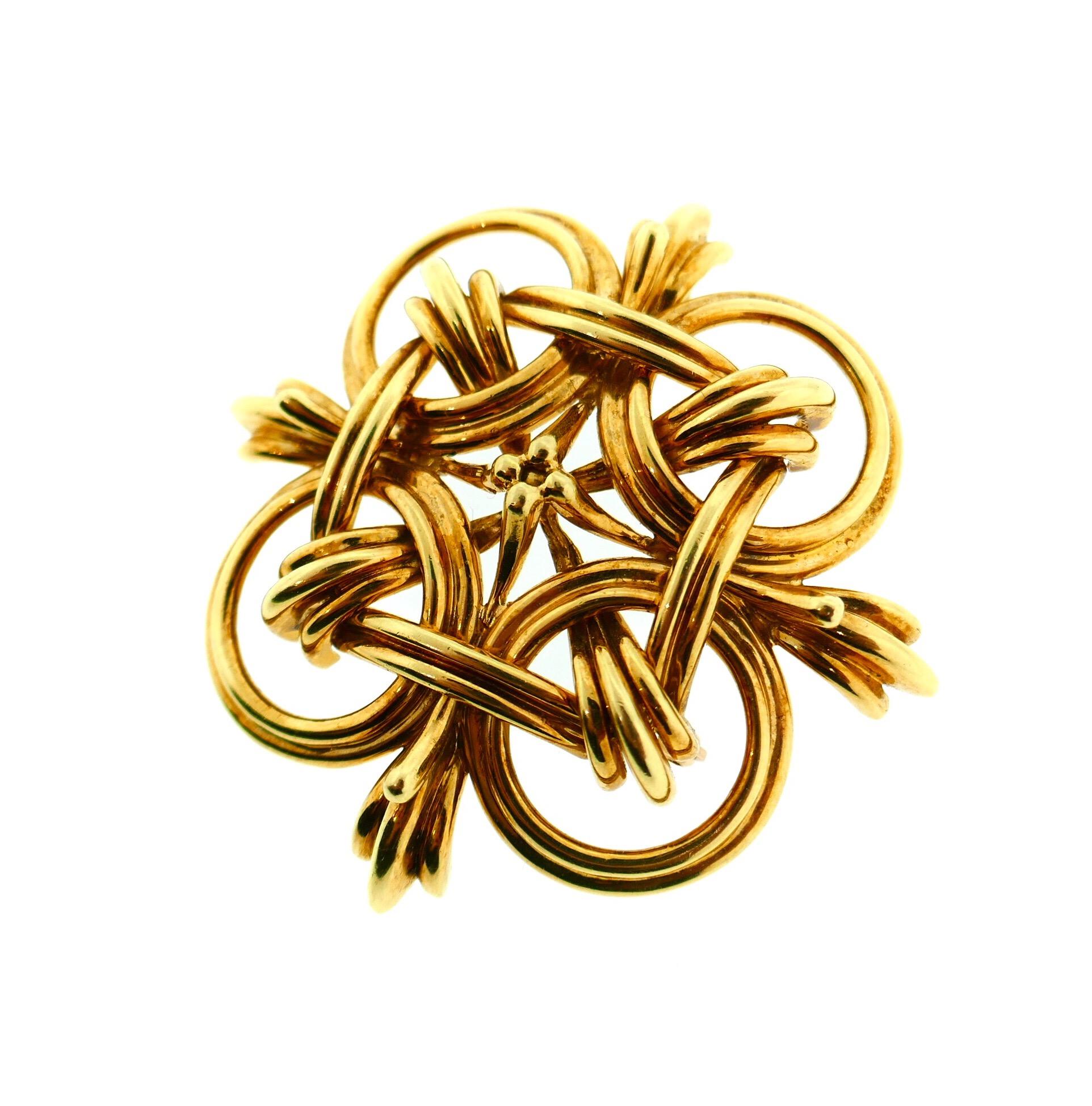 Cartier 18 Karat Yellow Gold Pendant / Brooch

This absolutely stunning vintage Cartier piece can be worn as a pendant or a brooch. The piece features an intricate design in amazing detail. It is substantial in size and definitely stands