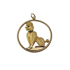 Colgante Caniche Cartier de oro amarillo de 18 quilates con rubí y esmeralda #19678