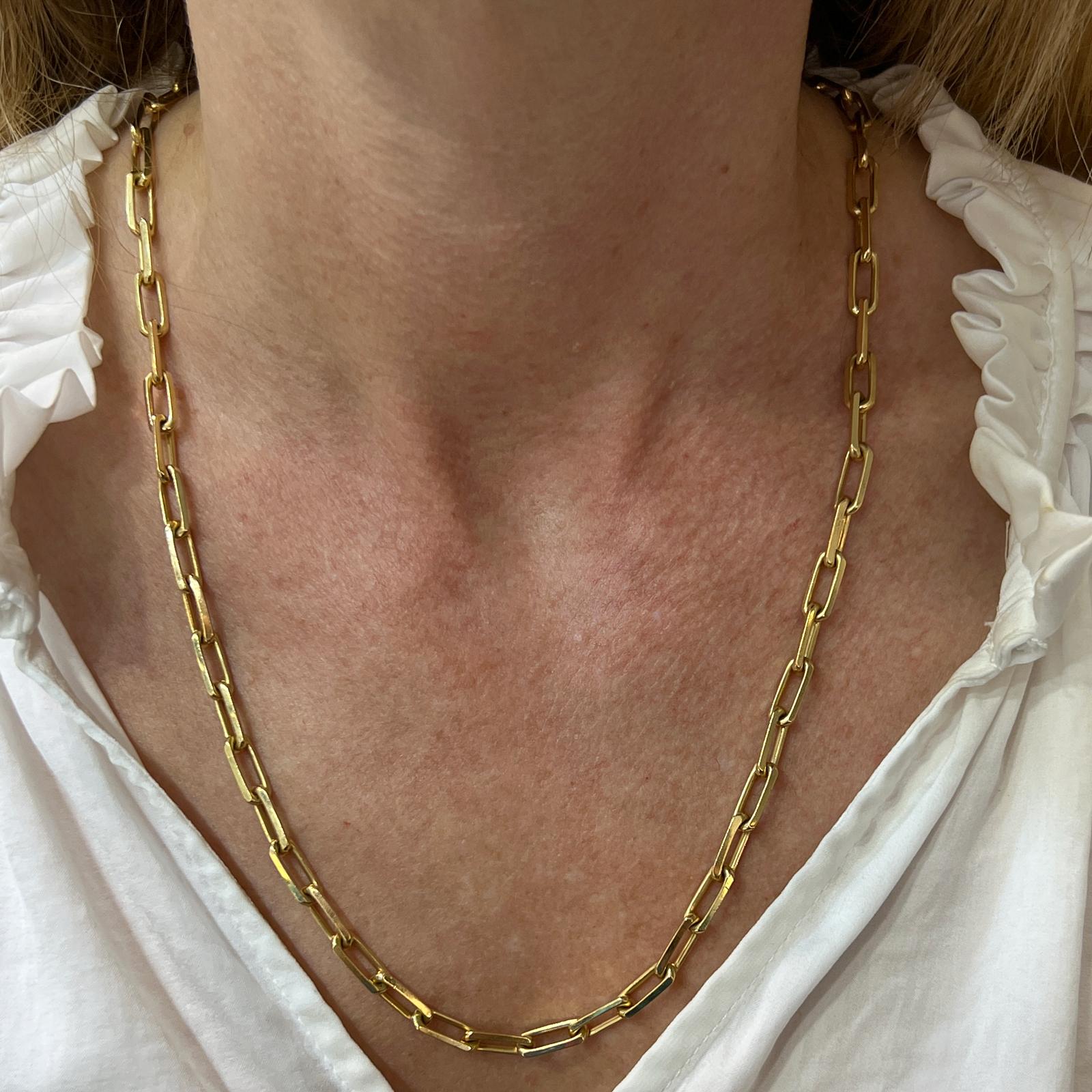 Cartier Santos Dumont oval link chain fashioned in 18 karat yellow gold. The link necklace measures 22.5 inches in length and comes with original box and papers. Purchased in 2018. Signed Cartier, numbered, and hallmarked. 
MSRP: $7,950.00