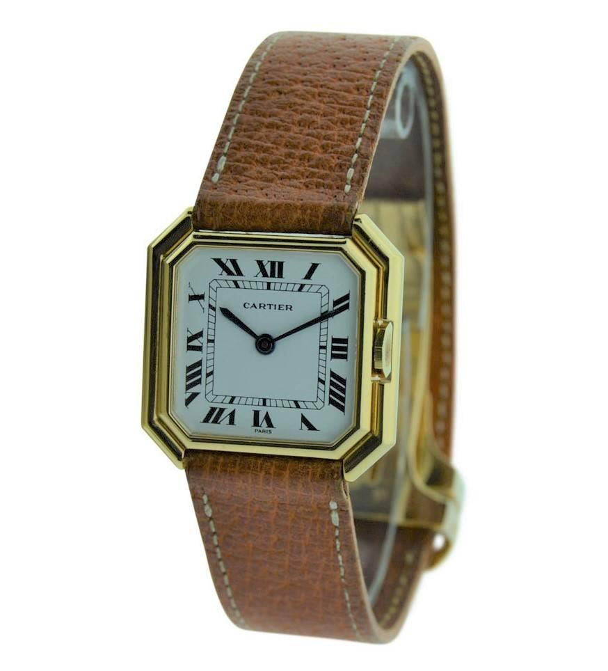 FACTORY / HOUSE: Cartier Jewelers 
STYLE / REFERENCE: Art Deco / Tank Ceinture
METAL / MATERIAL: 18kt. Solid Gold
CIRCA: 1977
DIMENSIONS: 27mm X 27mm
MOVEMENT / CALIBER: Manual Winding / 17 Jewels 
DIAL / HANDS: Original with Roman Numerals / Blued