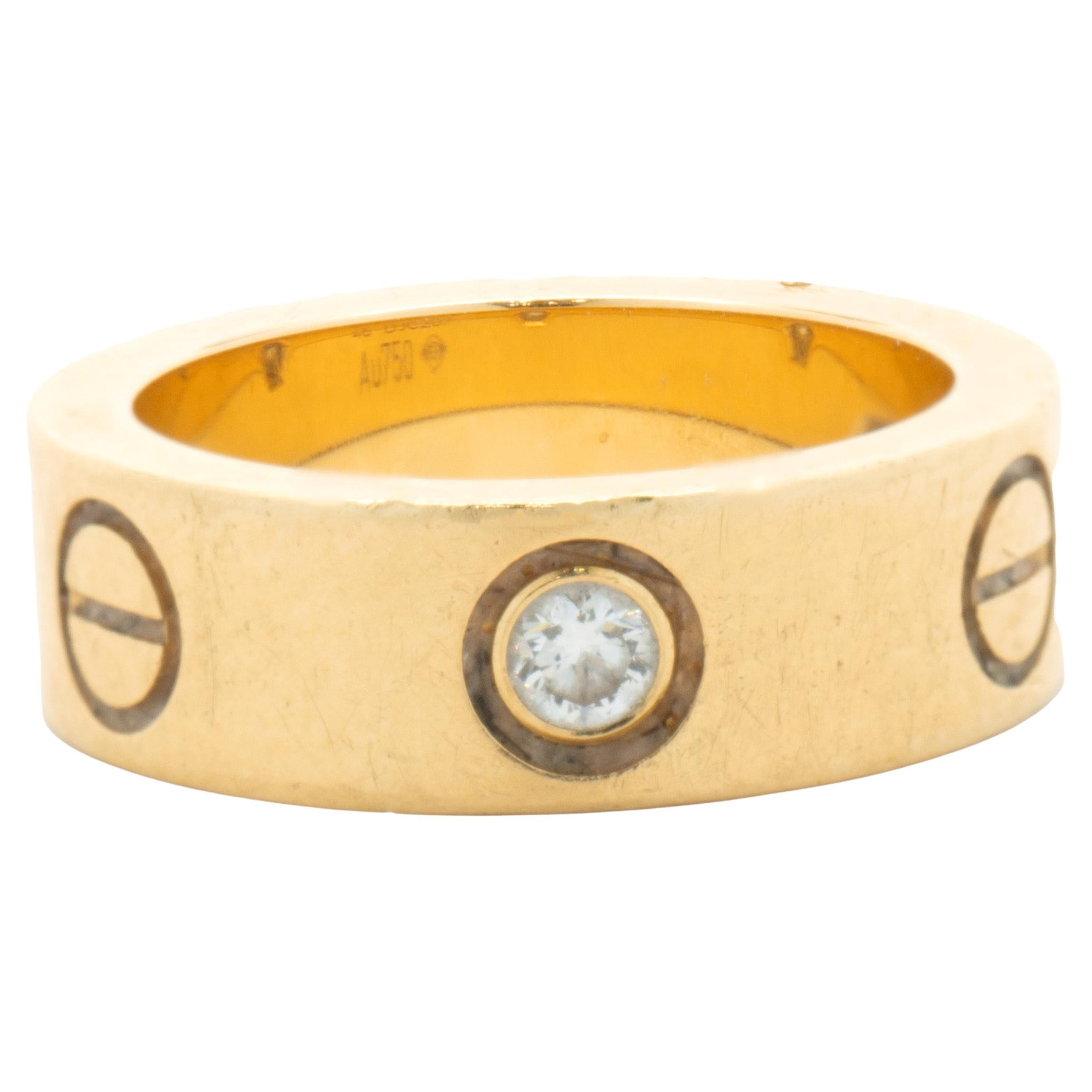 Cartier: 18 Karat Gelbgold Love-Ring mit drei Diamanten im Angebot