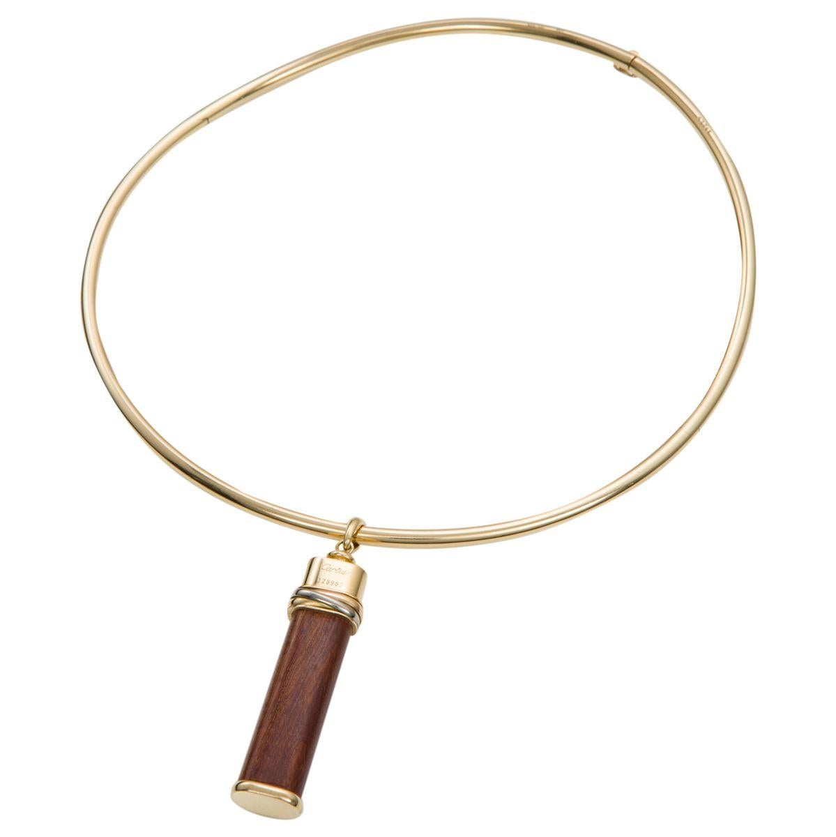 Ever so chic and timeless, like all Cartier jewels which are designed to transcend eras, years and generations. This elegant Cartier 18k yellow gold Toucher de Bois (known as Knock on Wood) pendant and collar are a wonderful combination. The