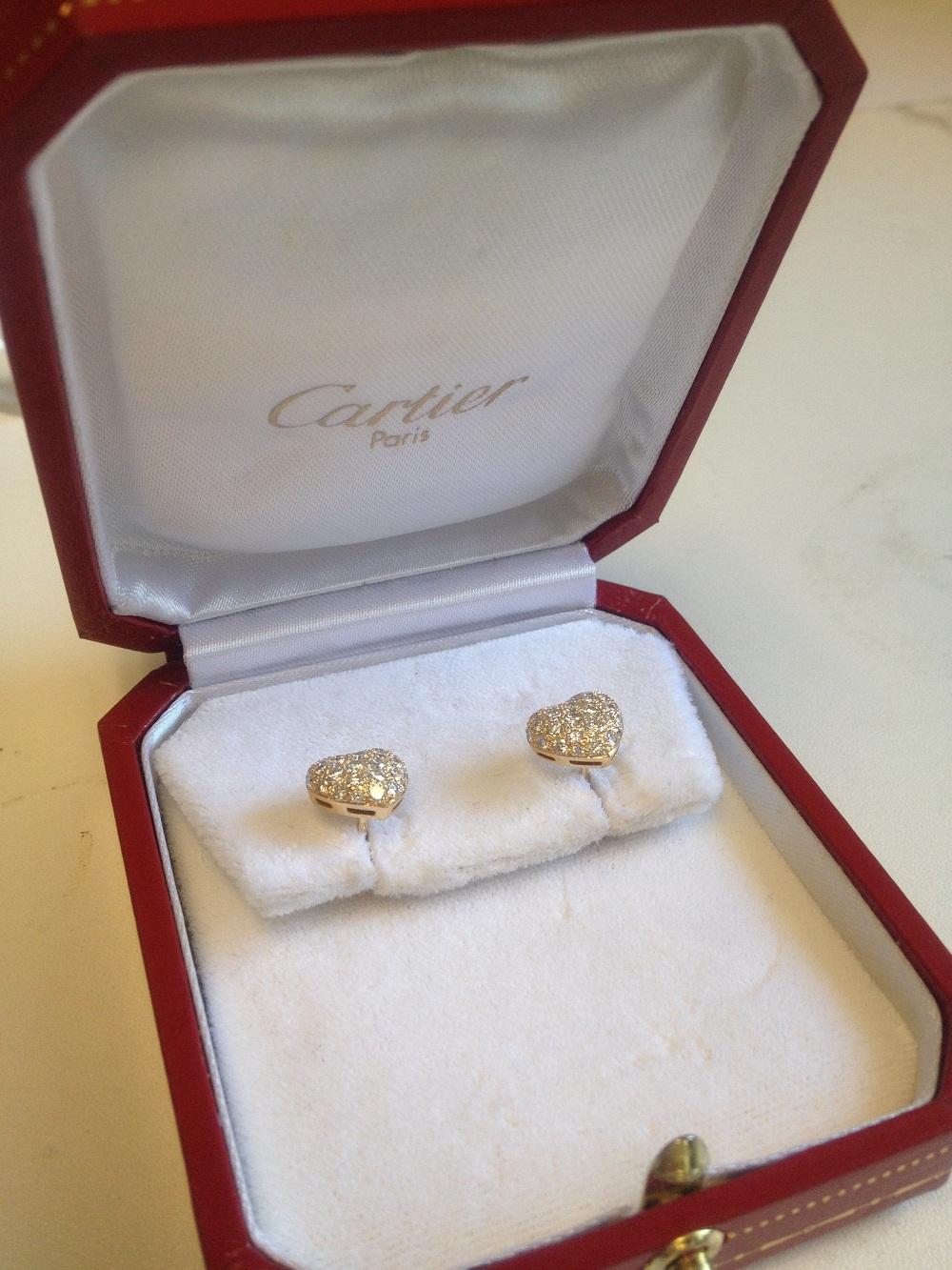 Cartier 18k Yellow Pave Diamond Heart Earrings french clutch backs  W/ Box and Receipt,  Estimated Retail Replacement $16,000.00.

Description:  18K yellow gold and pave diamond hear shaped earrings signed by Cartier with serial #'s. They feature