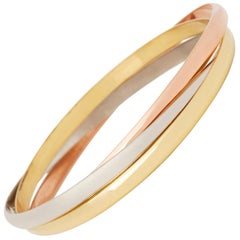 Cartier 18 Karat Yellow, White and Rose Gold Medium Trinity Bangle Bracelet