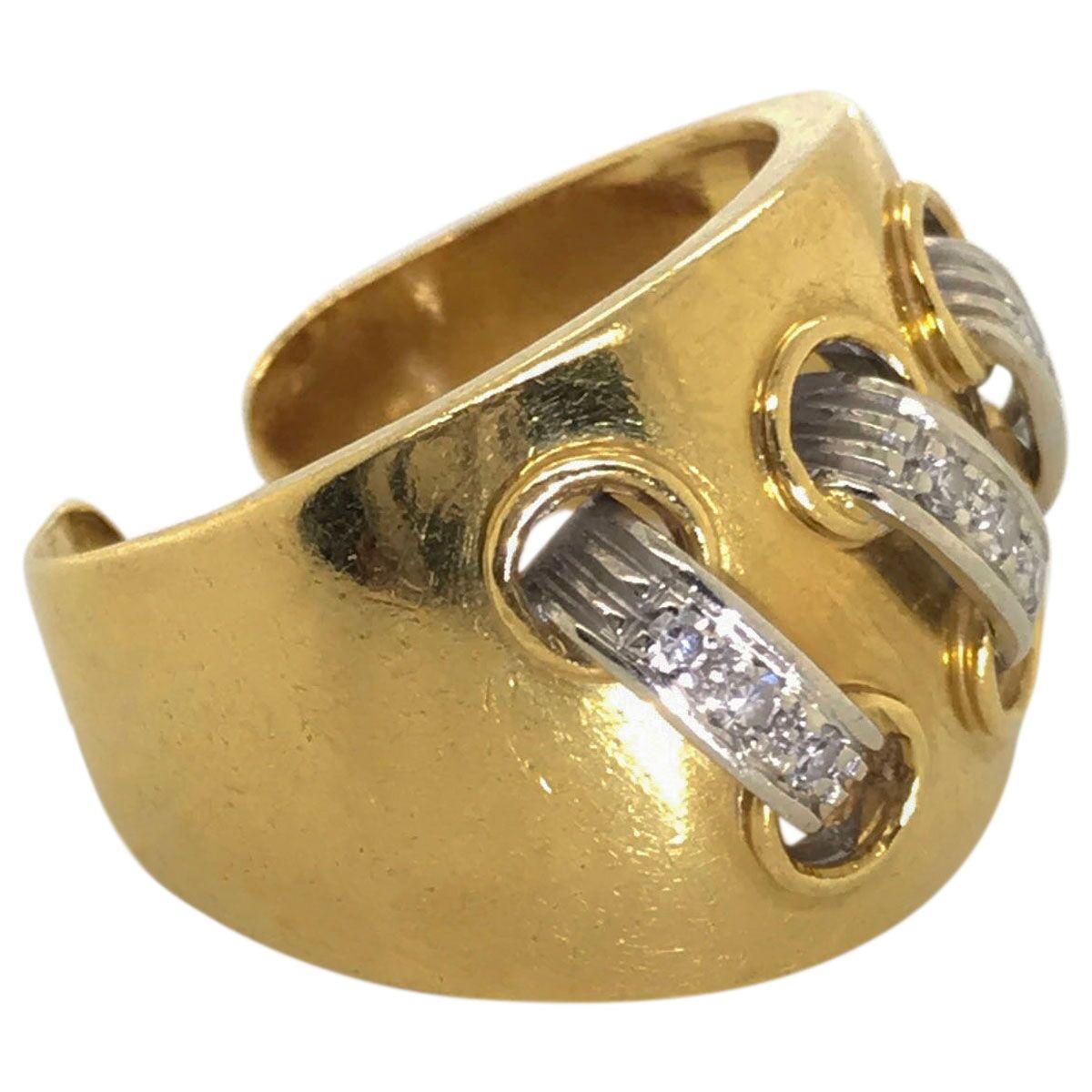 Cartier chic! This fabulous and stylish 'Lace Up' ring is designed with an open back so it can be resized to suit but it's best worn on the middle finger for a super cool look. Fashioned in 18k yellow and white gold, it is designed as a wide ring