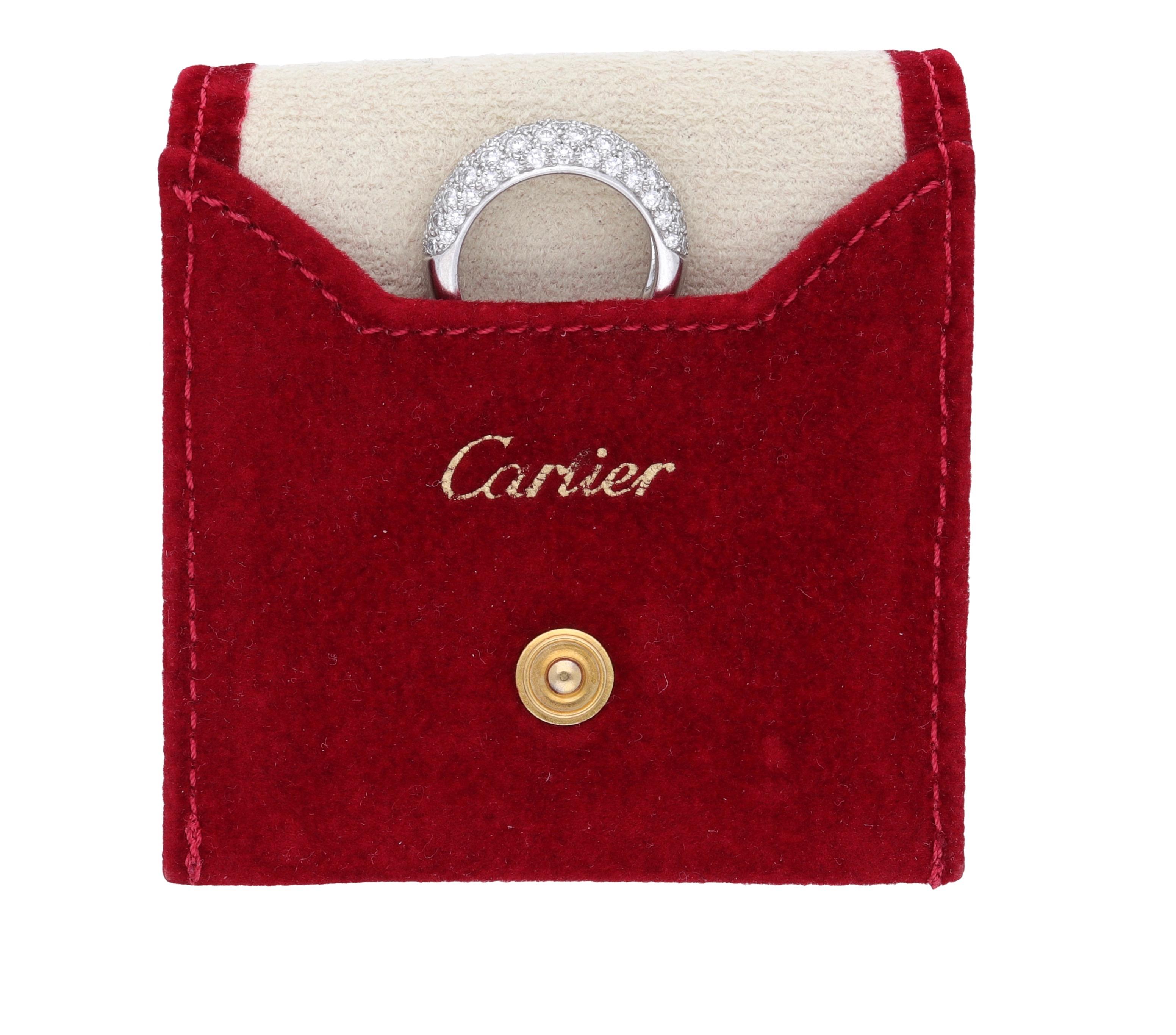18 kt. white gold bombe ring signed by Cartier.
This classic ring is realized with 1.30 carat of round-cut diamonds and comes in the original red pouch.
Ring size is 6