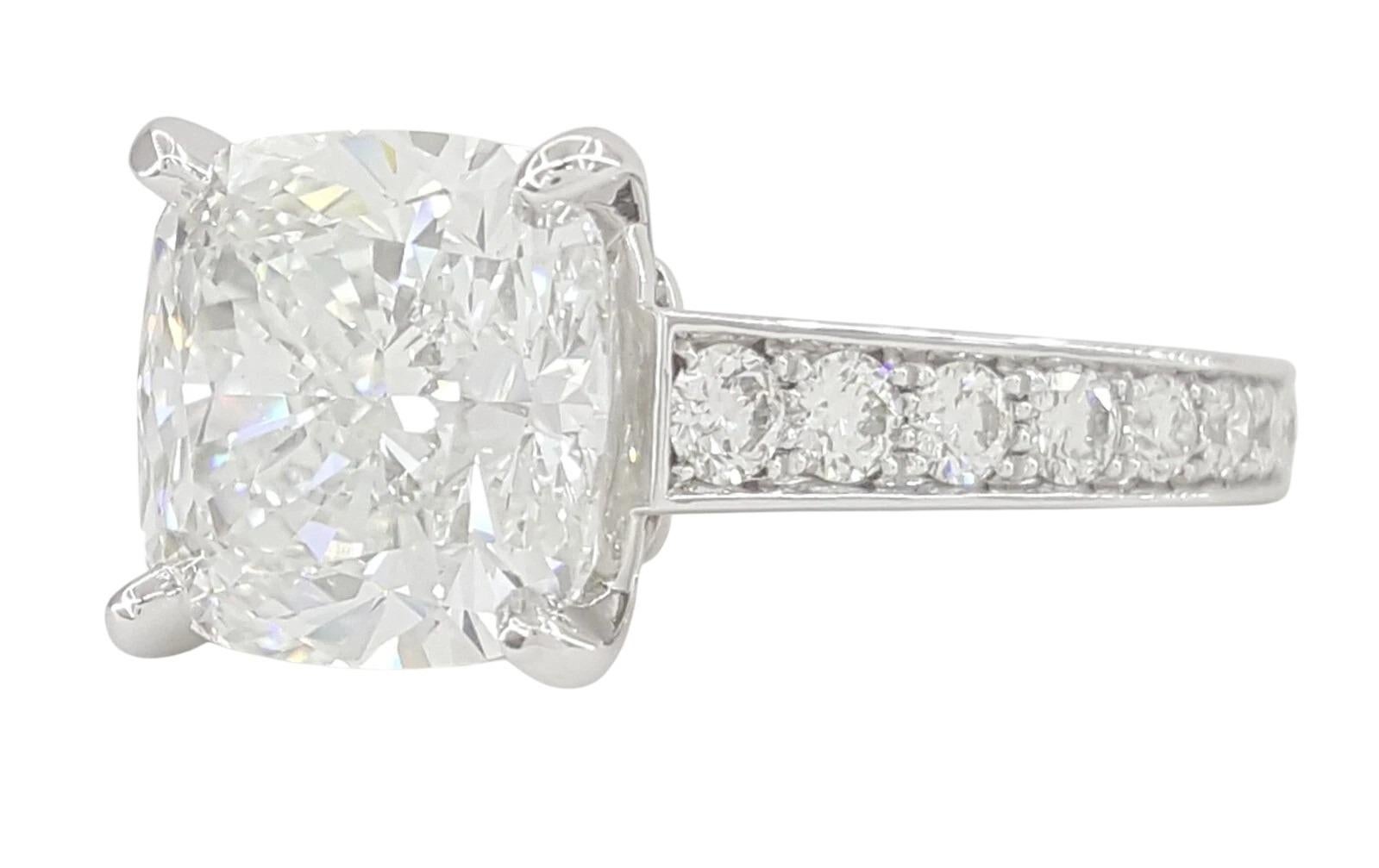 An exquisite and iconic Cartier 1895 solitaire engagement ring, showcasing a stunning GIA-certified 3.51 carat cushion brilliant cut diamond, graded F color and VS2 clarity, with Excellent Polish, Excellent Symmetry, and no fluorescence.

Crafted in