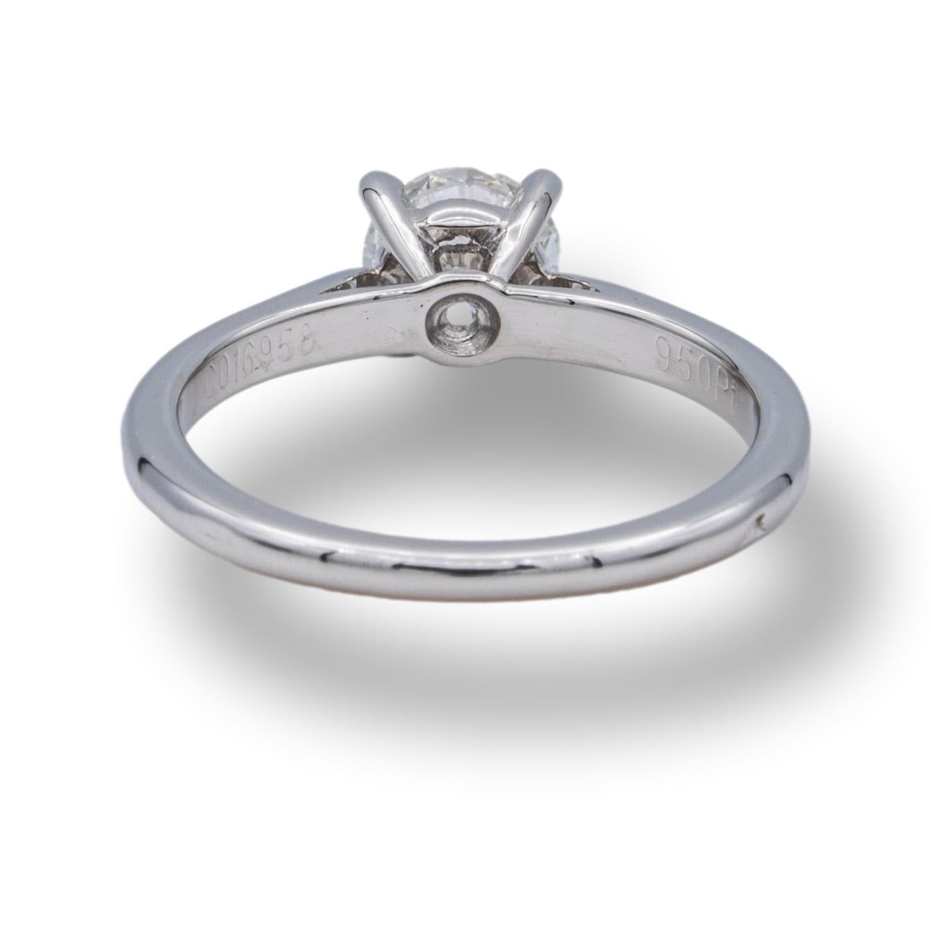 Cartier engagement ring from the 1895 collection finely crafted in platinum with a round brilliant cut diamond center weighing 0.55 cts. G color VVS2 clarity graded by the GIA ( Gemological Institute of America). The GIA report confirms both the