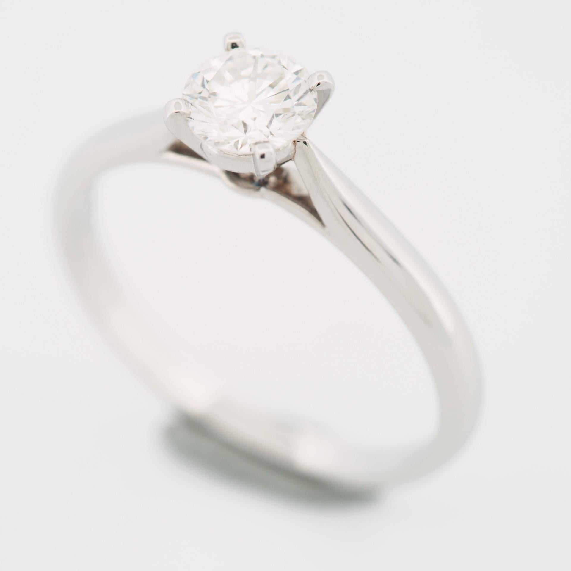 Item: Authentic Cartier 1895 Diamond Solitaire Ring
Stones: Diamond (0.41ct)
Color: G
Clarity:VVS2
Polish: Very Good
Symmetry: Very Good
Fluorescence: Faint
Metal: Platinum 950
Ring Size: 49 US SIZE 4.5 UK SIZE I 1/2
Internal Diameter: 15.45