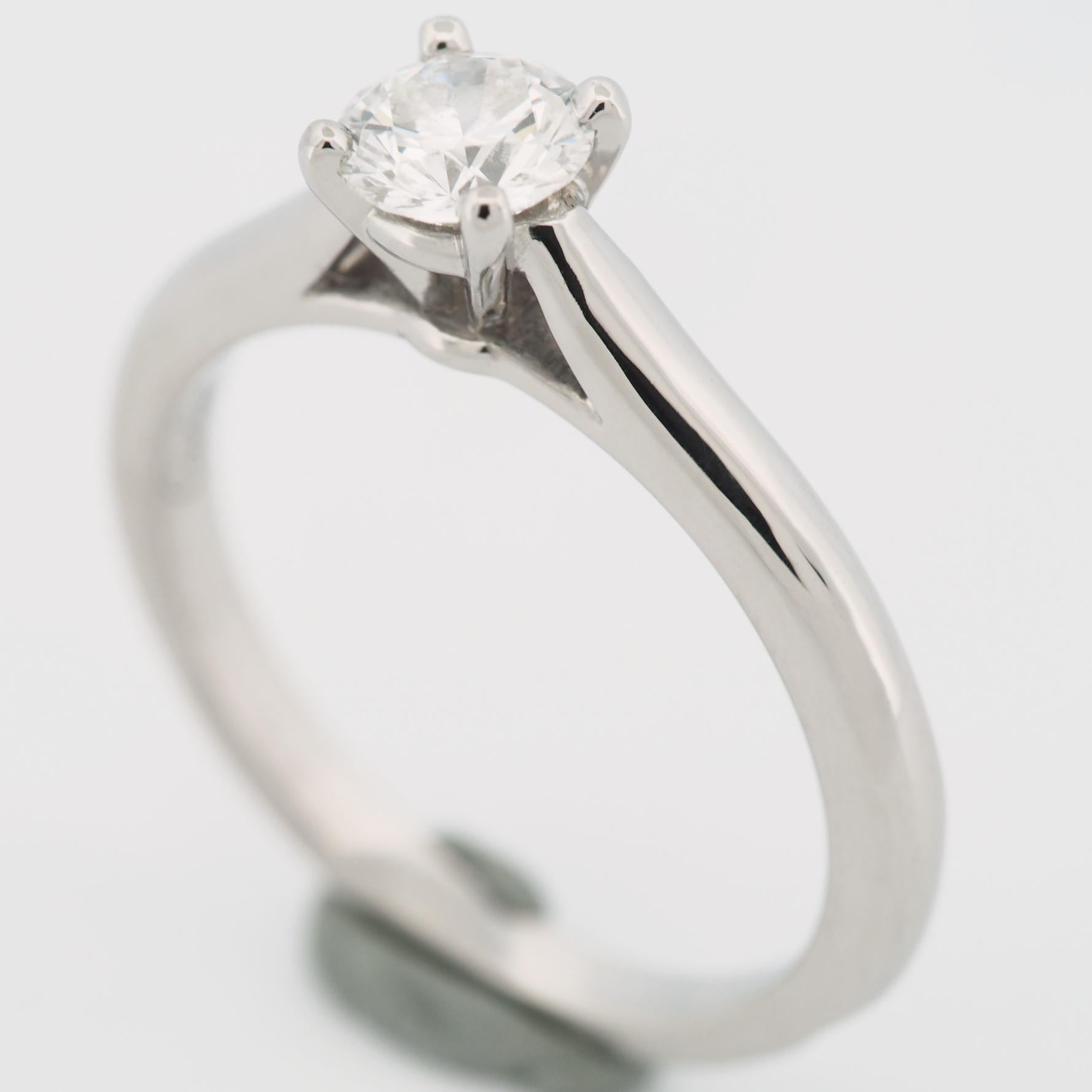 Item: Authentic Cartier 1895 Diamond Solitaire Ring
Stones: Diamond (0.45ct)
Color: E
Clarity: VVS1
Polish: Very Good
Symmetry: Excellent
Fluorescence: None
Metal: Platinum 950
Ring Size: 51 US SIZE 5.5 UK SIZE K 1/2
Internal Diameter: 16.25