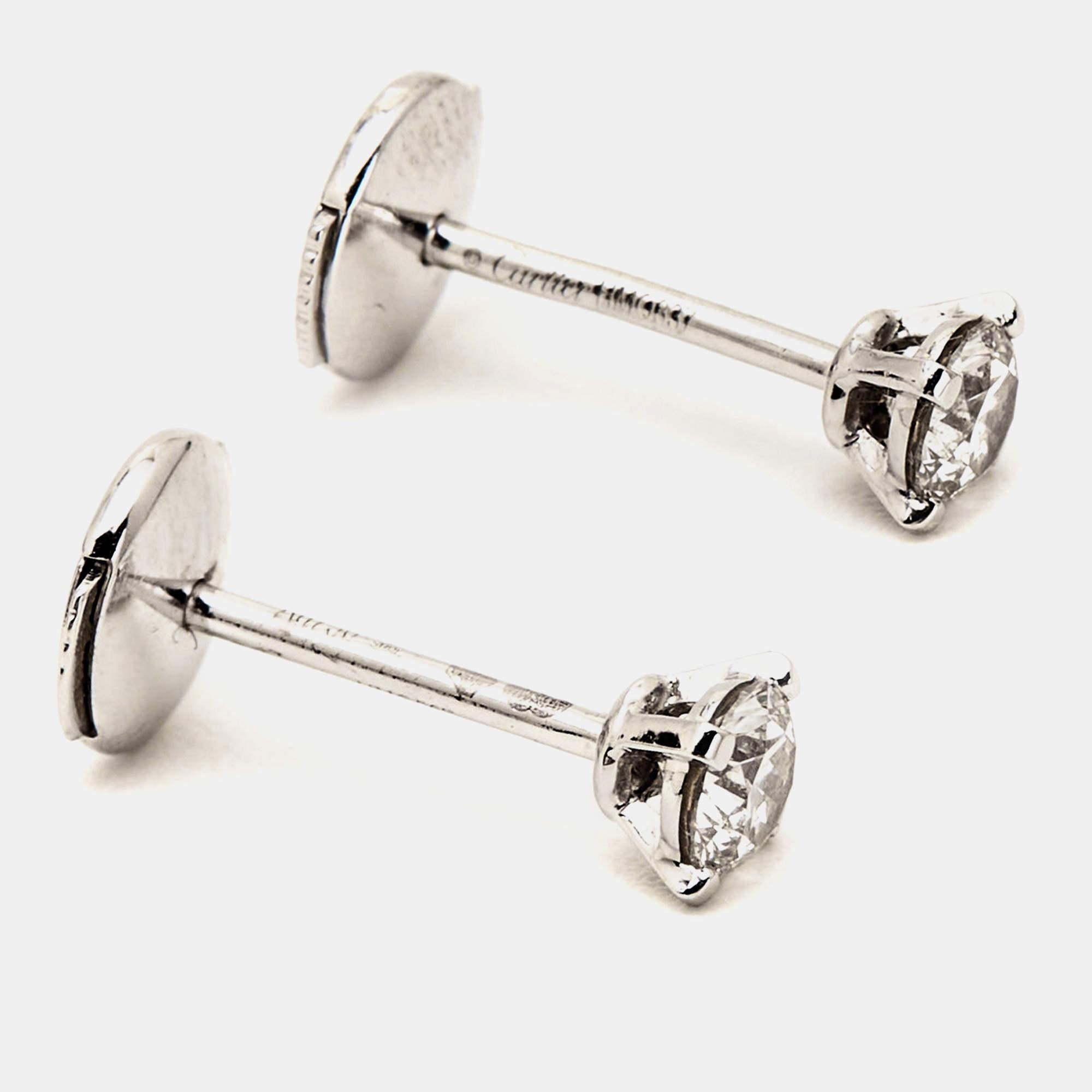 The Cartier 1895 Solitaire diamond earrings are exquisite jewelry pieces. Crafted in 18k white gold, these stud earrings feature single diamonds, creating a sparkling and elegant look. With their impeccable craftsmanship and understated elegance,