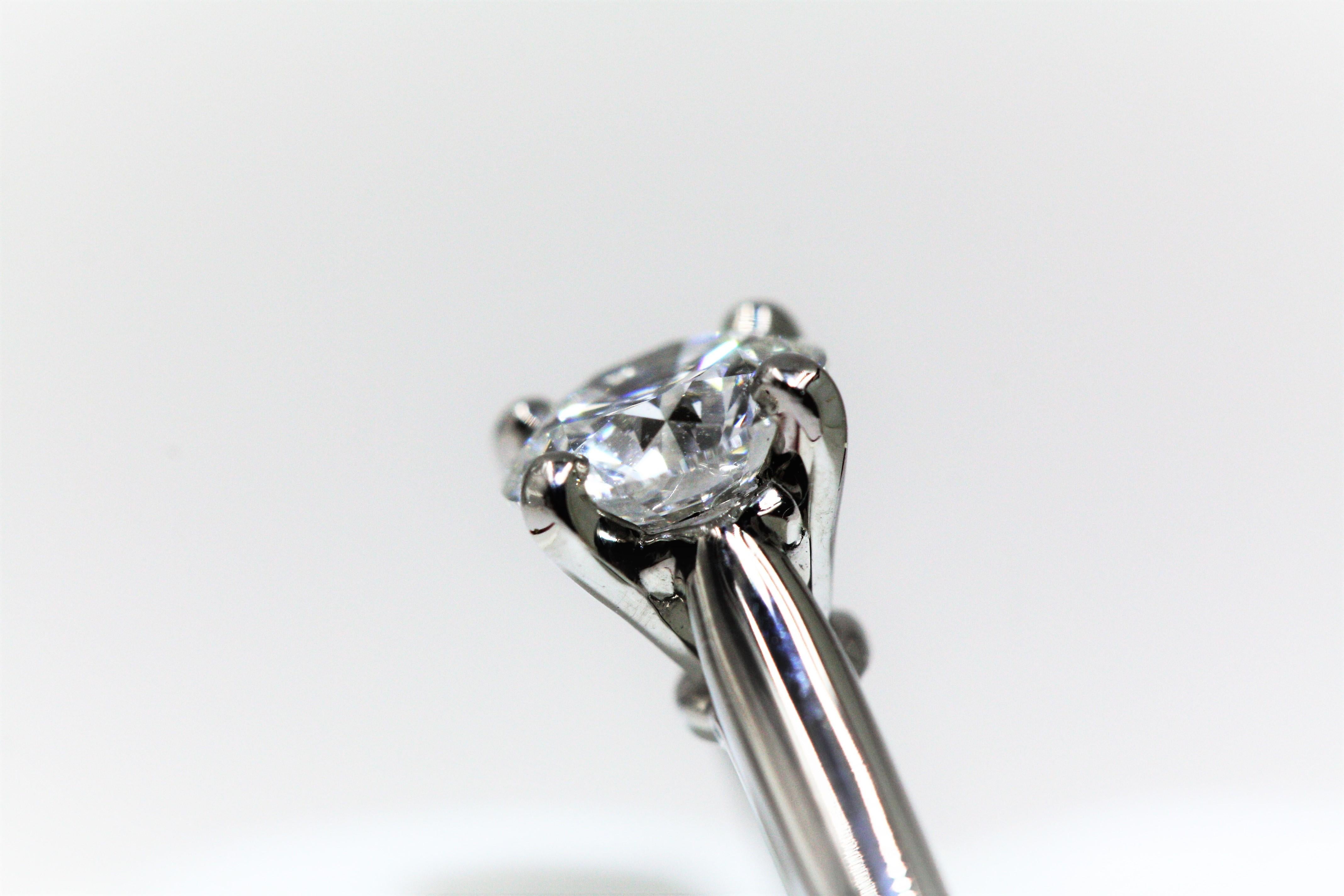 Cartier 1895 Solitaire Platinum Diamond Ring, 0.7 Carat VVS1 E In Excellent Condition For Sale In New York, NY