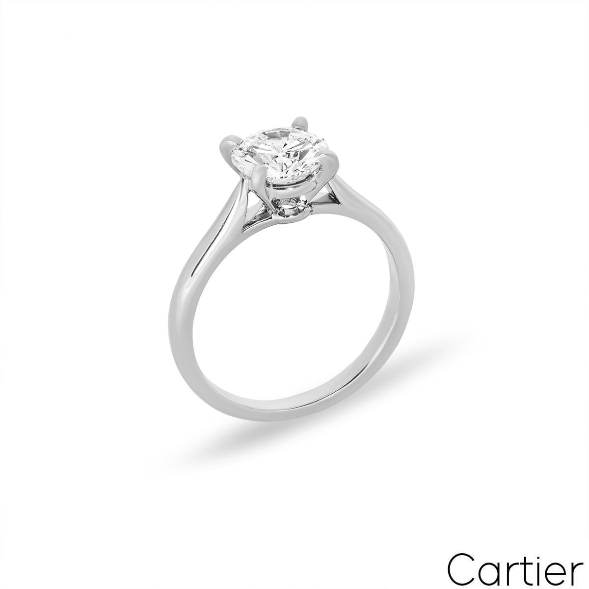 A stunning platinum Cartier diamond engagement ring from the 1895 solitaire collection. The ring comprises of a round brilliant cut diamond in a four claw setting with a weight of 1.54ct, G colour and VS2 clarity. The 2.4mm ring has a gross weight